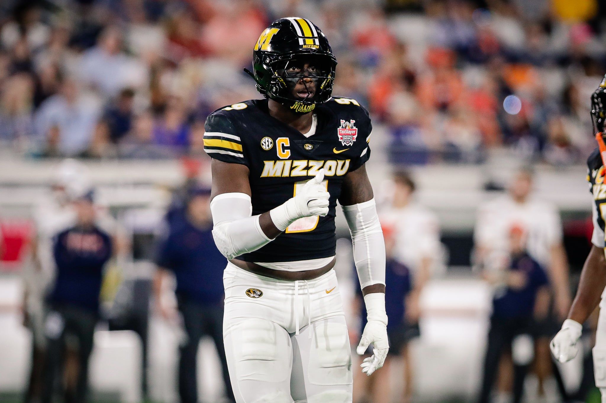 Dec 27, 2025; Jacksonville, FL, USA; Missouri Tigers defensive end Zion Young (9) looks on before a play against the Virginia Cavaliers in the first half at EverBank Stadium.
