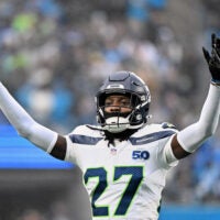 Dec 28, 2025; Charlotte, North Carolina, USA; Seattle Seahawks cornerback Riq Woolen (27) reacts against the Carolina Panthers during the second quarter at Bank of America Stadium.