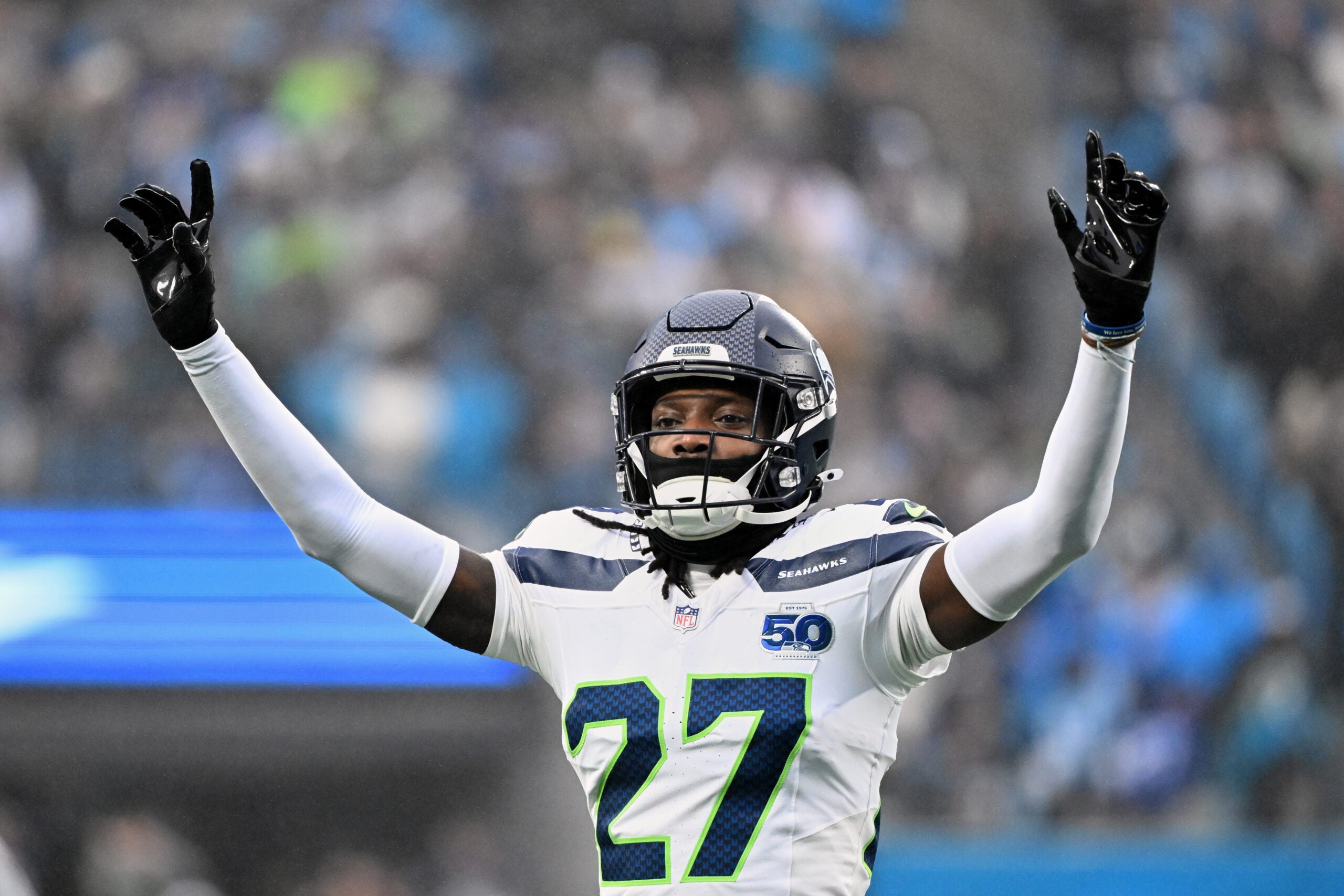Dec 28, 2025; Charlotte, North Carolina, USA; Seattle Seahawks cornerback Riq Woolen (27) reacts against the Carolina Panthers during the second quarter at Bank of America Stadium.