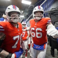 Buffalo Bills offensive tackle Alec Anderson and center Connor McGovern head out to the field after Buffalo Bills quarterback Josh Allen says a few words to the offensive line in the tunnel before they take the field to warm up before their game at Highmark Stadium in Orchard Park on Dec. 28, 2025.