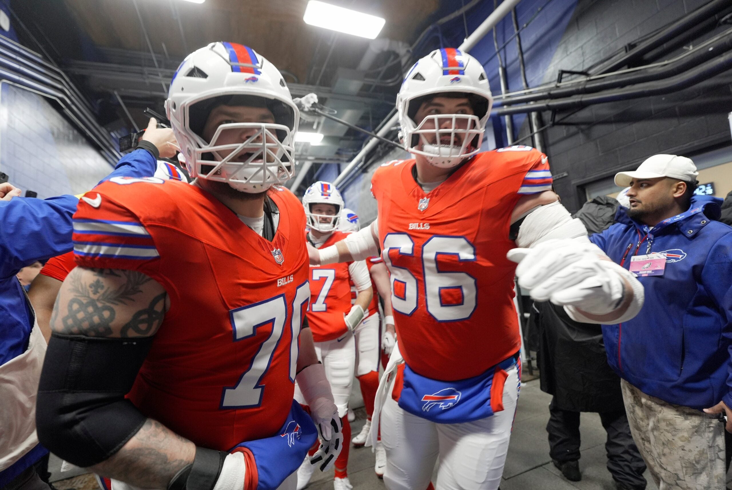 Buffalo Bills offensive tackle Alec Anderson and center Connor McGovern head out to the field after Buffalo Bills quarterback Josh Allen says a few words to the offensive line in the tunnel before they take the field to warm up before their game at Highmark Stadium in Orchard Park on Dec. 28, 2025.