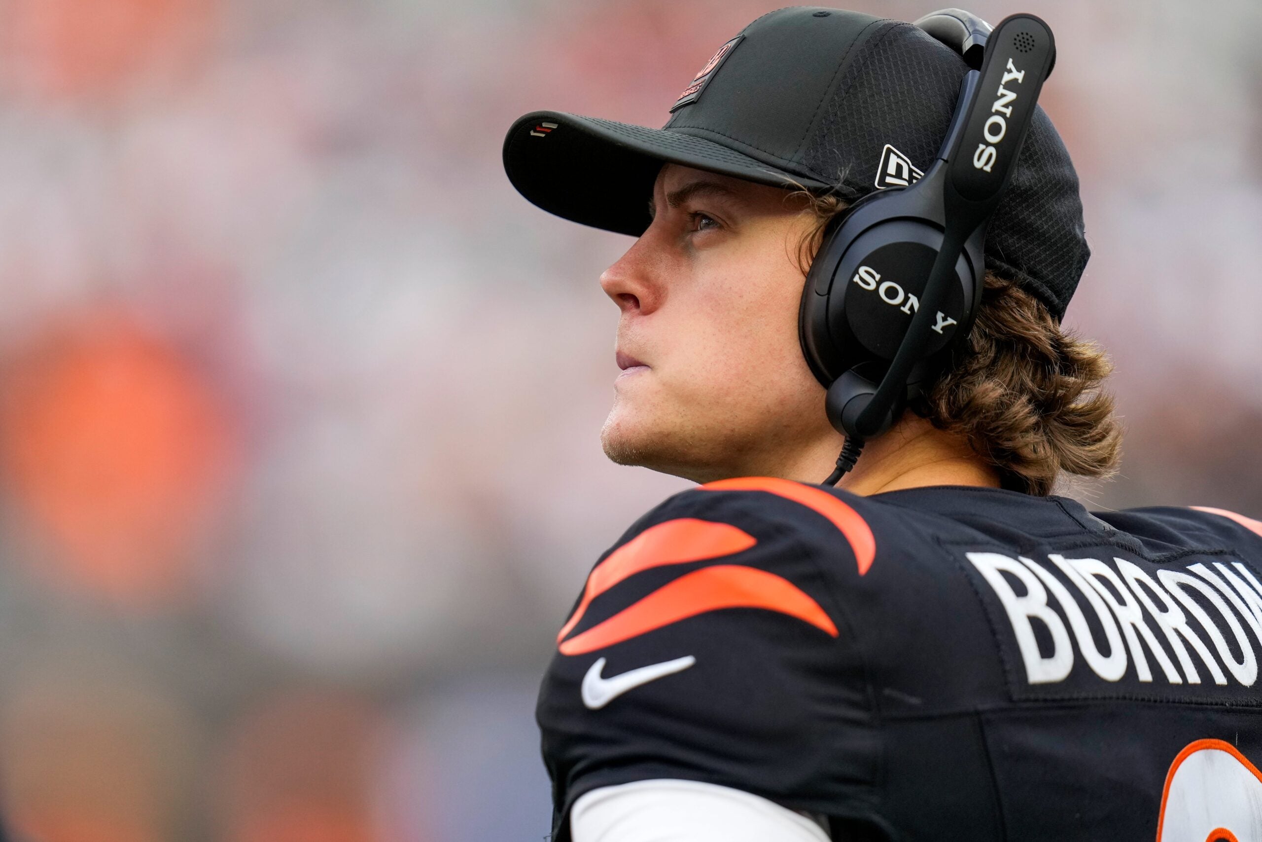 Cincinnati Bengals quarterback Joe Burrow (9) looks on from the sideline after leaving the game in the fourth quarter of the NFL Week 17 game between the Cincinnati Bengals and the Arizona Cardinals at Paycor Stadium in Downtown Cincinnati on Sunday, Dec. 28, 2025. The Bengals won 37-14.