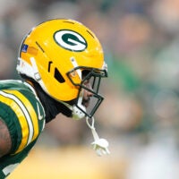 Dec 27, 2025; Green Bay, Wisconsin, USA; Green Bay Packers cornerback Nate Hobbs (21) waits for the kickoff return during the second quarter against the Baltimore Ravens at Lambeau Field.