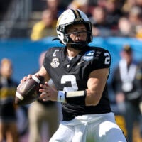Dec 31, 2025; Tampa, FL, USA; Vanderbilt Commodores quarterback Diego Pavia (2) throws a pass against the Iowa Hawkeyes in the first quarter during the ReliaQuest Bowl at Raymond James Stadium.