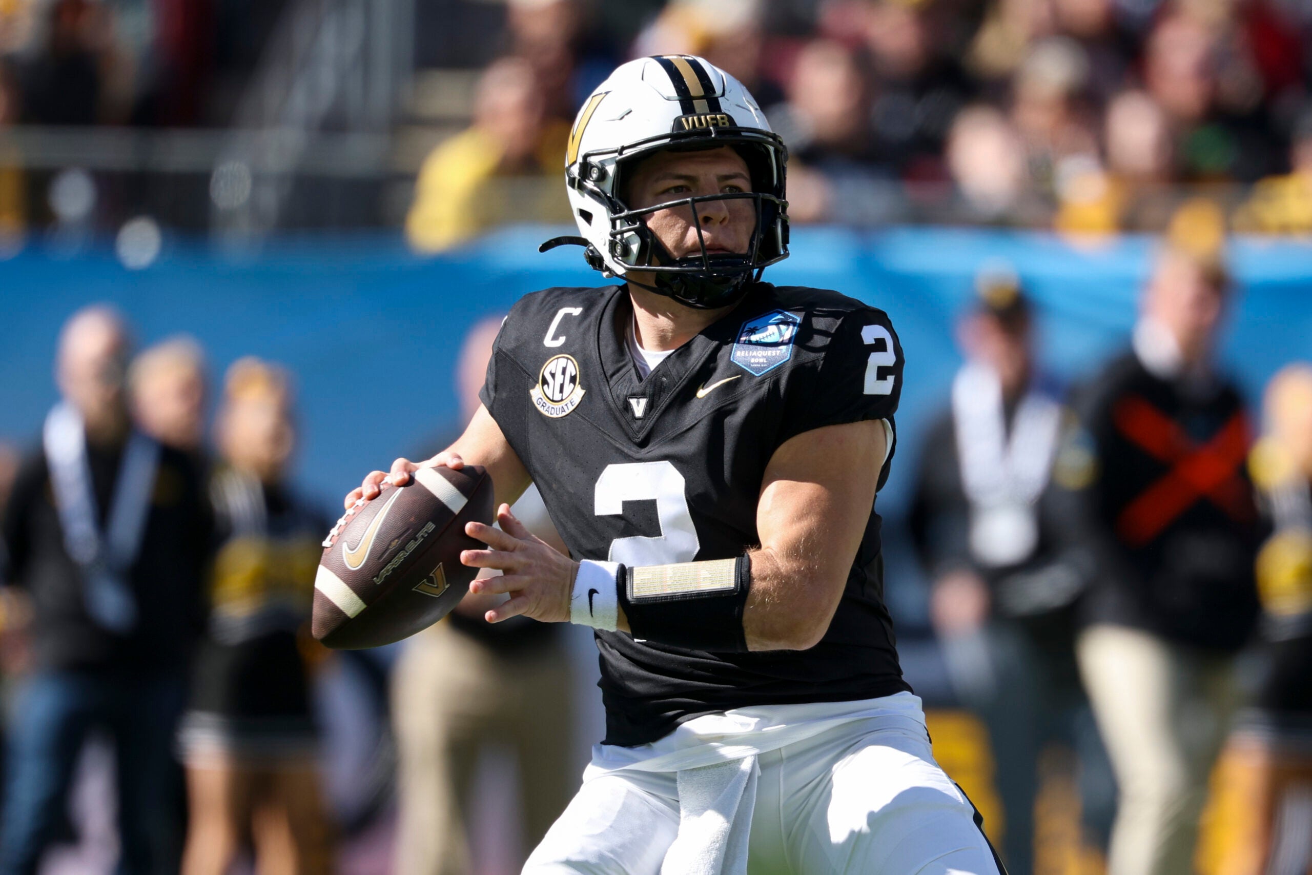 Dec 31, 2025; Tampa, FL, USA; Vanderbilt Commodores quarterback Diego Pavia (2) throws a pass against the Iowa Hawkeyes in the first quarter during the ReliaQuest Bowl at Raymond James Stadium.