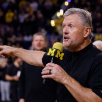 Jan 2, 2026; Ann Arbor, Michigan, USA; Michigan Wolverines football head coach Kyle Whittingham speaks to the crowd during a time out in the first half against the Southern California Trojans at Crisler Center.