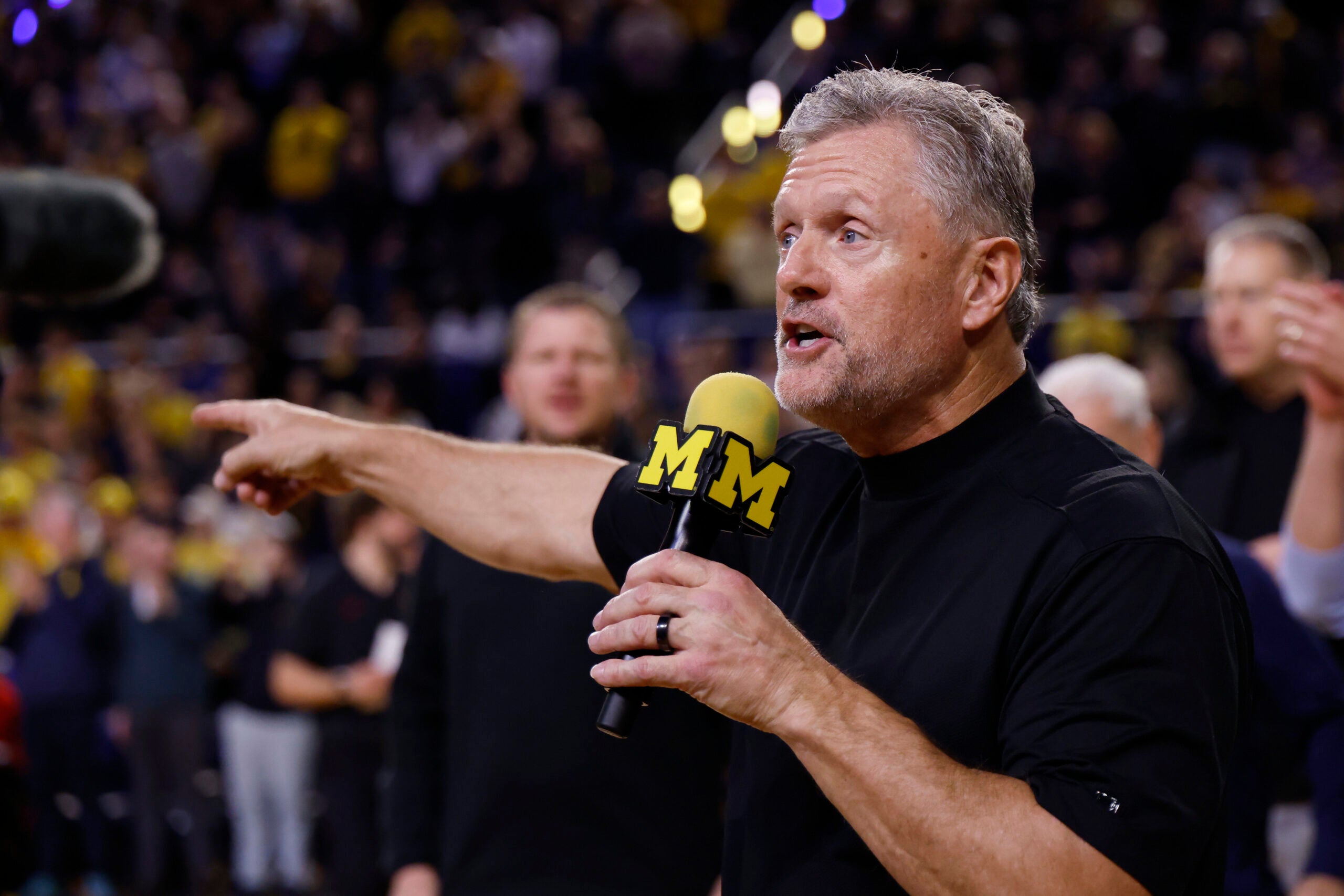 Jan 2, 2026; Ann Arbor, Michigan, USA; Michigan Wolverines football head coach Kyle Whittingham speaks to the crowd during a time out in the first half against the Southern California Trojans at Crisler Center.