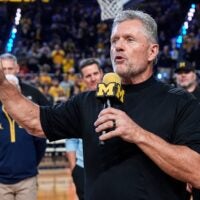 Michigan football head coach Kyle Whittingham speaks as he is being introduced on the floor during the first half between Michigan and USC at Crisler Center in Ann Arbor on Friday, Jan. 2, 2026.