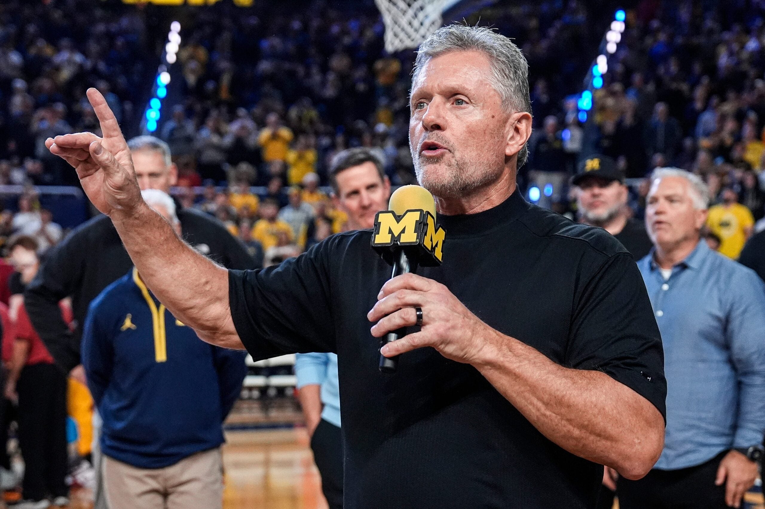 Michigan football head coach Kyle Whittingham speaks as he is being introduced on the floor during the first half between Michigan and USC at Crisler Center in Ann Arbor on Friday, Jan. 2, 2026.