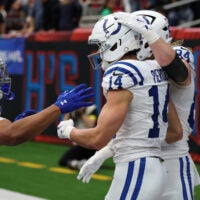 Colts RB Jonathan Taylor and TE Tyler Warren celebrate with WR Alec Pierce after a touchdown catch