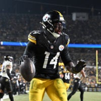 Jan 4, 2026; Pittsburgh, Pennsylvania, USA; Pittsburgh Steelers running back Kenneth Gainwell (14) rushes for a touchdown against the Baltimore Ravens during the second half at Acrisure Stadium.