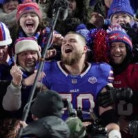 Buffalo Bills offensive tackle Alec Anderson jumps into the fans and sits with them after the game and while a video of game memories at Highmark Stadium played on the jumbotron. The Bills had their last home game at Highmark Stadium in Orchard Park on Jan. 4, 2026 against the JEts and won.