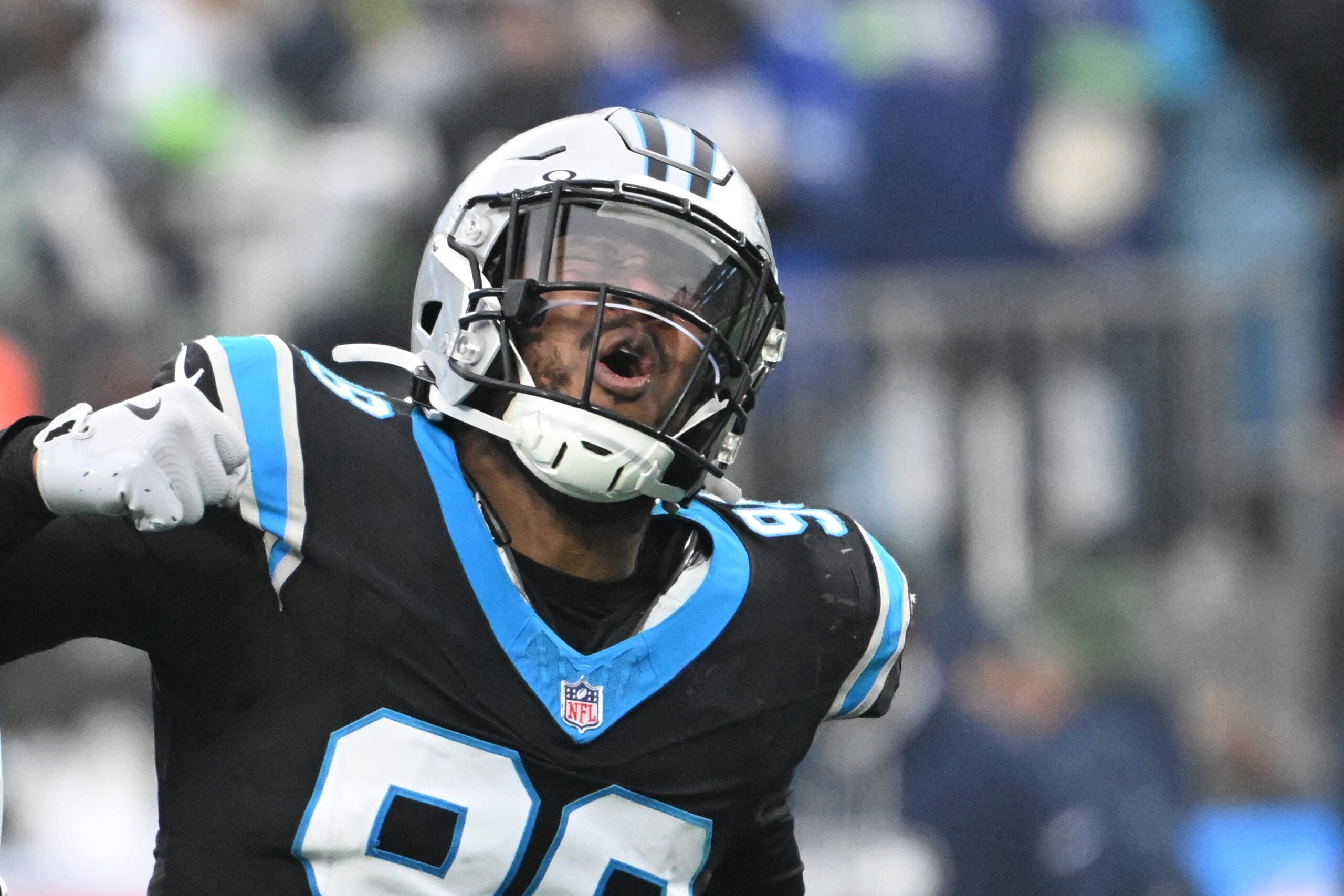 Dec 28, 2025; Charlotte, North Carolina, USA; Carolina Panthers linebacker D.J. Wonnum (98) reacts after a sack in the fourth quarter at Bank of America Stadium.