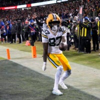 Jan 10, 2026; Chicago, IL, USA; Green Bay Packers wide receiver Romeo Doubs (87) reacts after scoring a touchdown against the Chicago Bears during the first half of an NFC Wild Card Round game at Soldier Field.