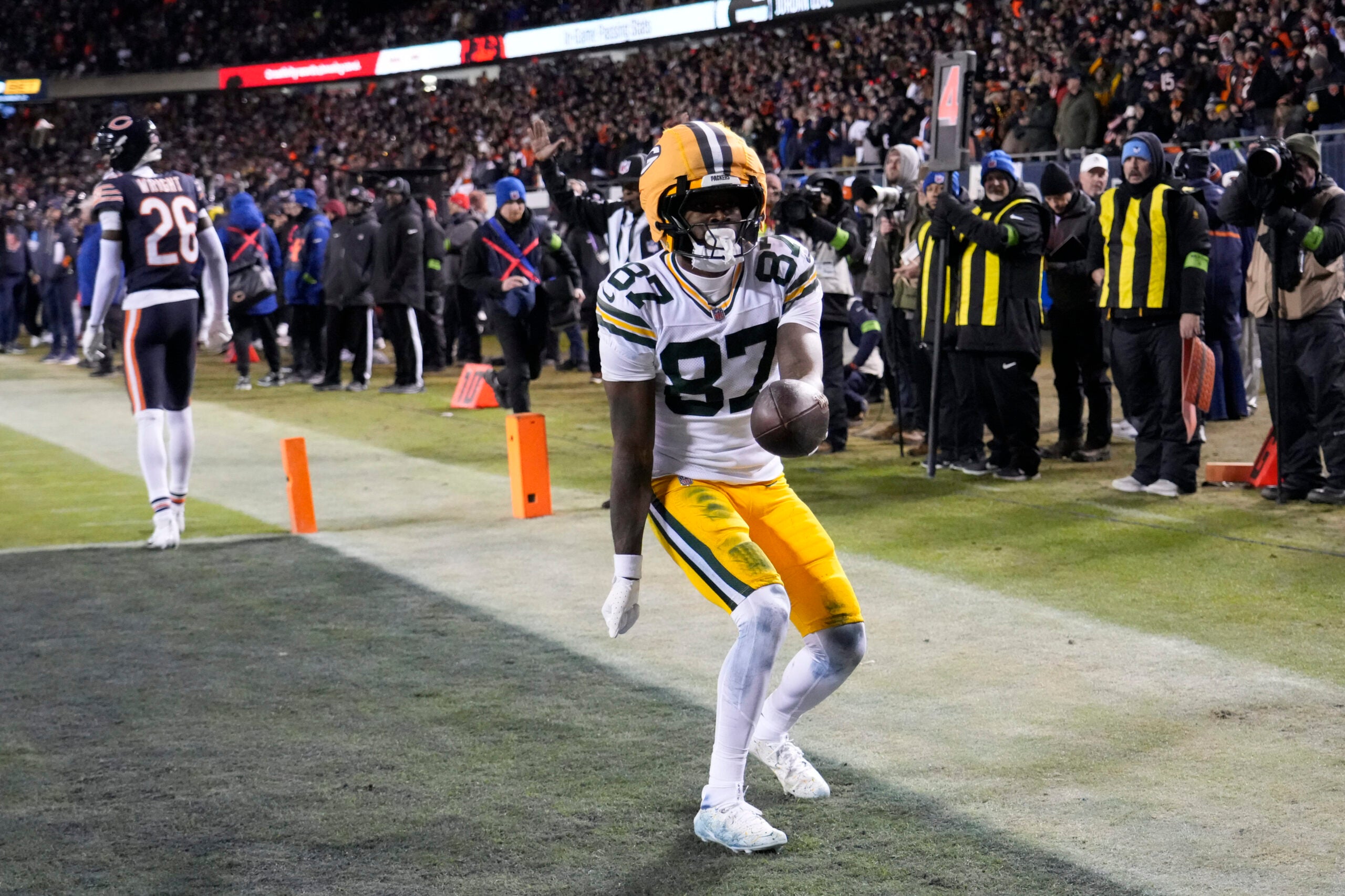Jan 10, 2026; Chicago, IL, USA; Green Bay Packers wide receiver Romeo Doubs (87) reacts after scoring a touchdown against the Chicago Bears during the first half of an NFC Wild Card Round game at Soldier Field.