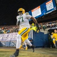 Green Bay Packers offensive tackle Anthony Belton (71) runs on to the field before their wild card playoff game Saturday, January 10, 2026 at Soldier Field in Chicago, Illinois. The Chicago Bears beat the Green Bay Packers 31-27.