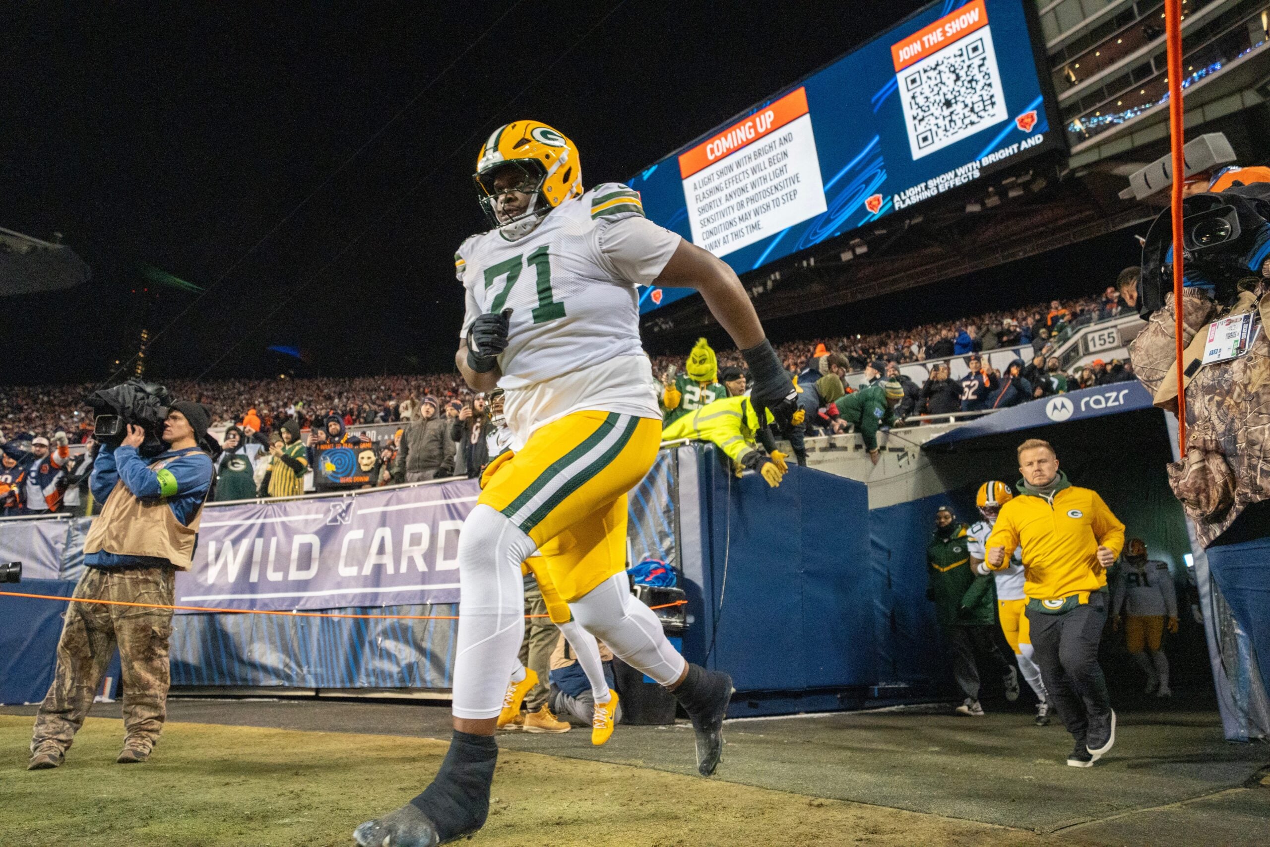 Green Bay Packers offensive tackle Anthony Belton (71) runs on to the field before their wild card playoff game Saturday, January 10, 2026 at Soldier Field in Chicago, Illinois. The Chicago Bears beat the Green Bay Packers 31-27.