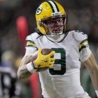 Green Bay Packers wide receiver Christian Watson (9) makes a catch for a first down during the second quarter of their wild card playoff game against the Chicago Bears Saturday, January 10, 2026 at Soldier Field in Chicago, Illinois.