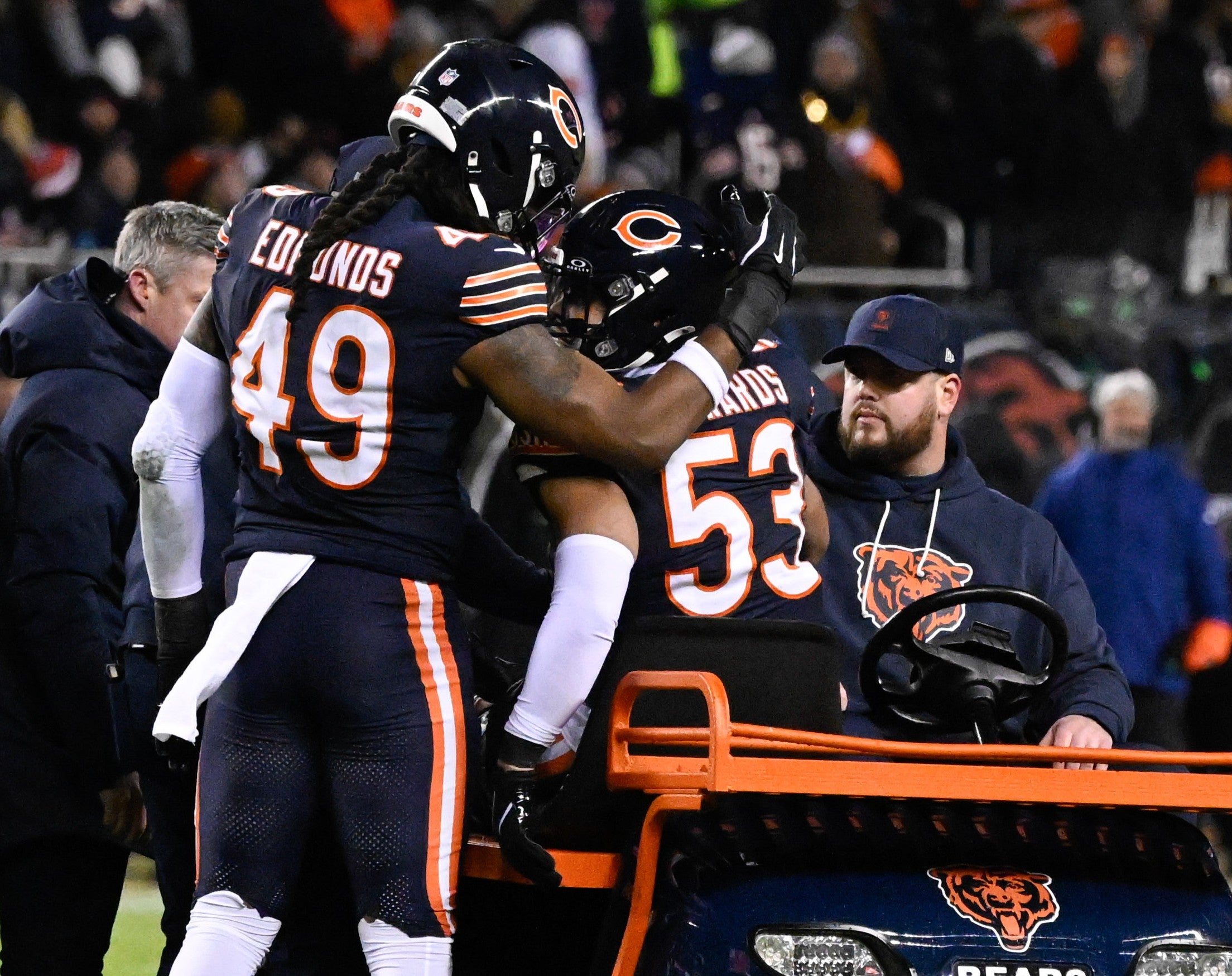 Jan 10, 2026; Chicago, IL, USA; in Chicago Bears linebacker Tremaine Edmunds (49) consoles linebacker T.J. Edwards (53) after he got injured during an NFC Wild Card Round game against the Green Bay Packers at Soldier Field.