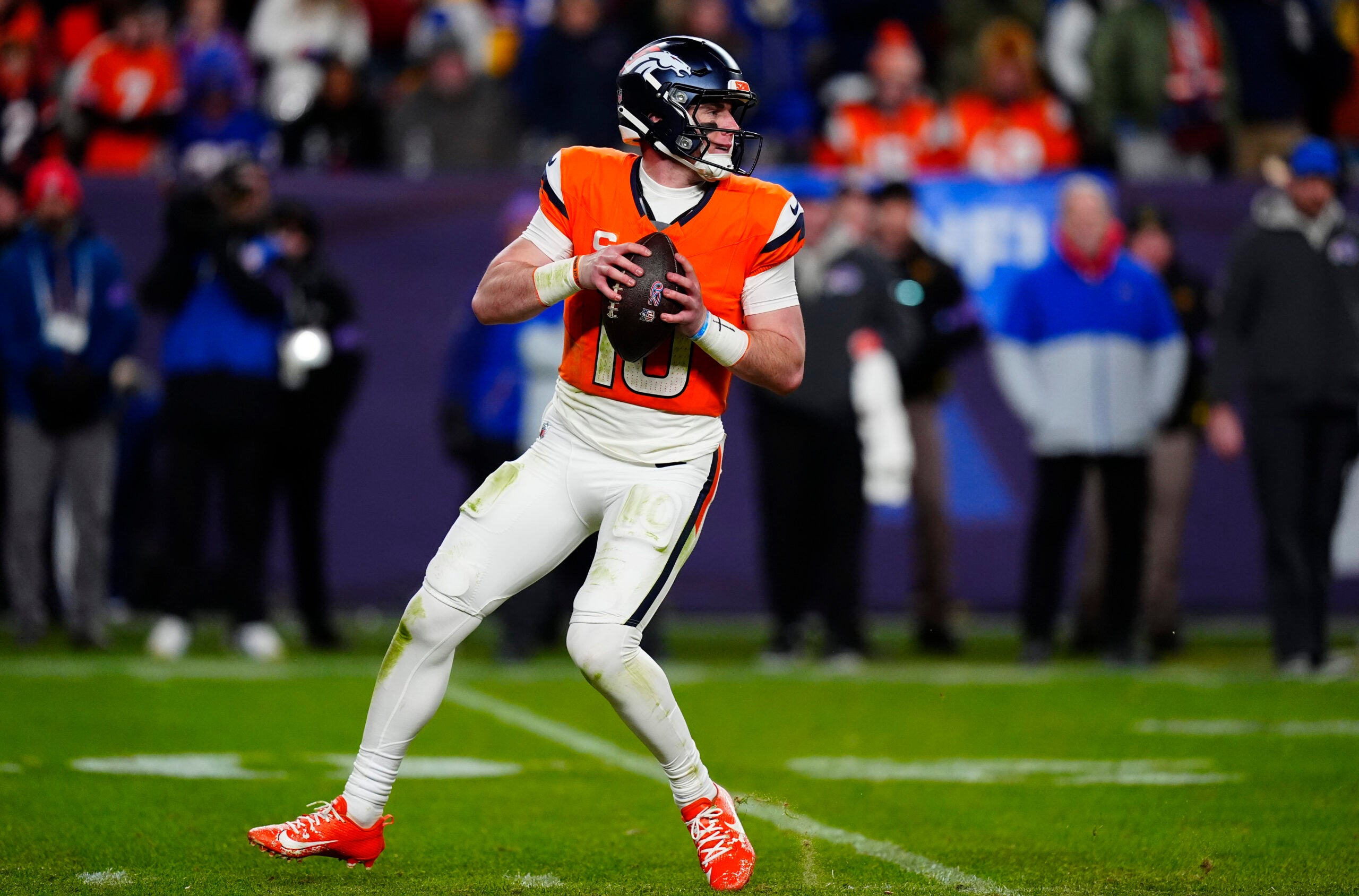 Jan 17, 2026; Denver, CO, USA; Denver Broncos quarterback Bo Nix (10) drops to throw during the fourth quarter of an AFC Divisional Round playoff game against the Buffalo Bills at Empower Field at Mile High.