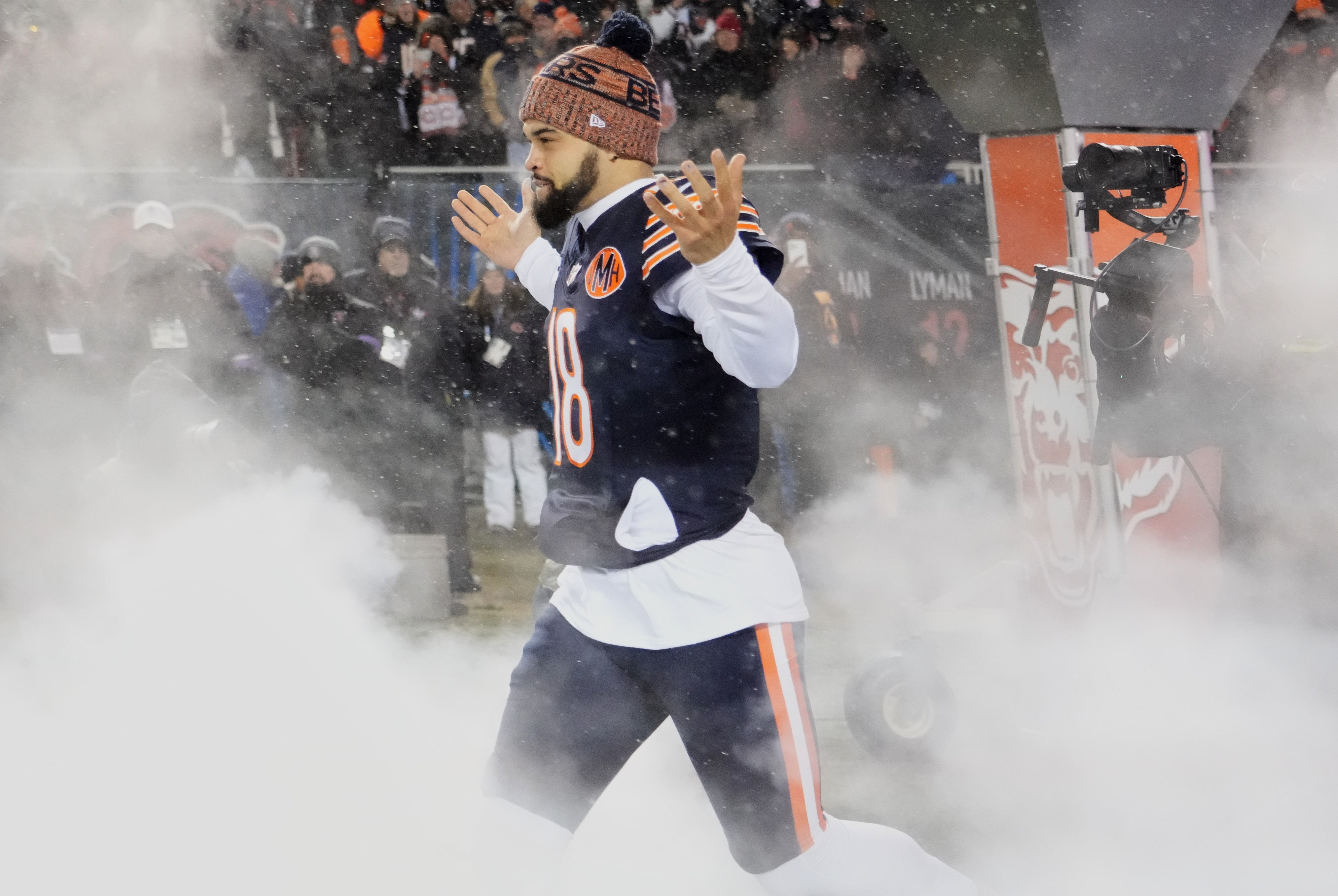 Jan 18, 2026; Chicago, IL, USA; Chicago Bears quarterback Caleb Williams (18) runs onto the field during player introductions before an NFC Divisional Round game against the Los Angeles Rams at Soldier Field.