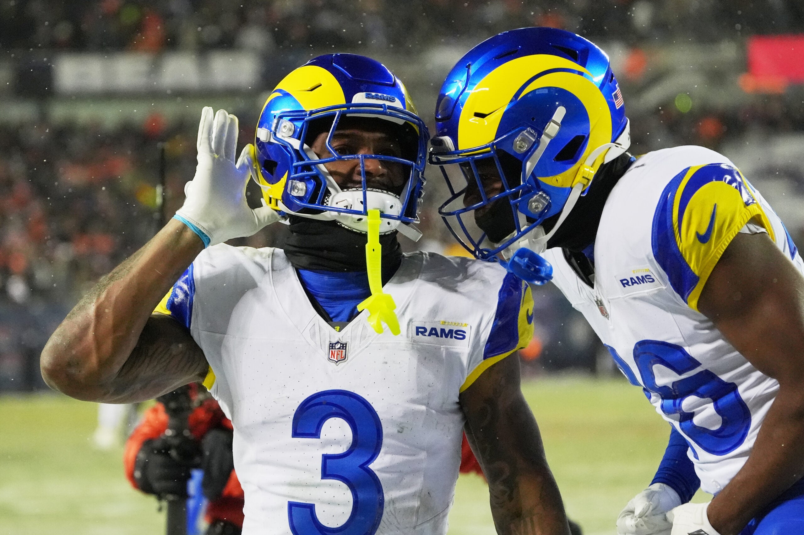 Jan 18, 2026; Chicago, IL, USA; Los Angeles Rams safety Kam Curl (3) acknowledges the crowd with safety Kamren Kinchens (26) after intercepting a pass intended for Chicago Bears wide receiver DJ Moore (not pictured) during overtime of an NFC Divisional Round game at Soldier Field.