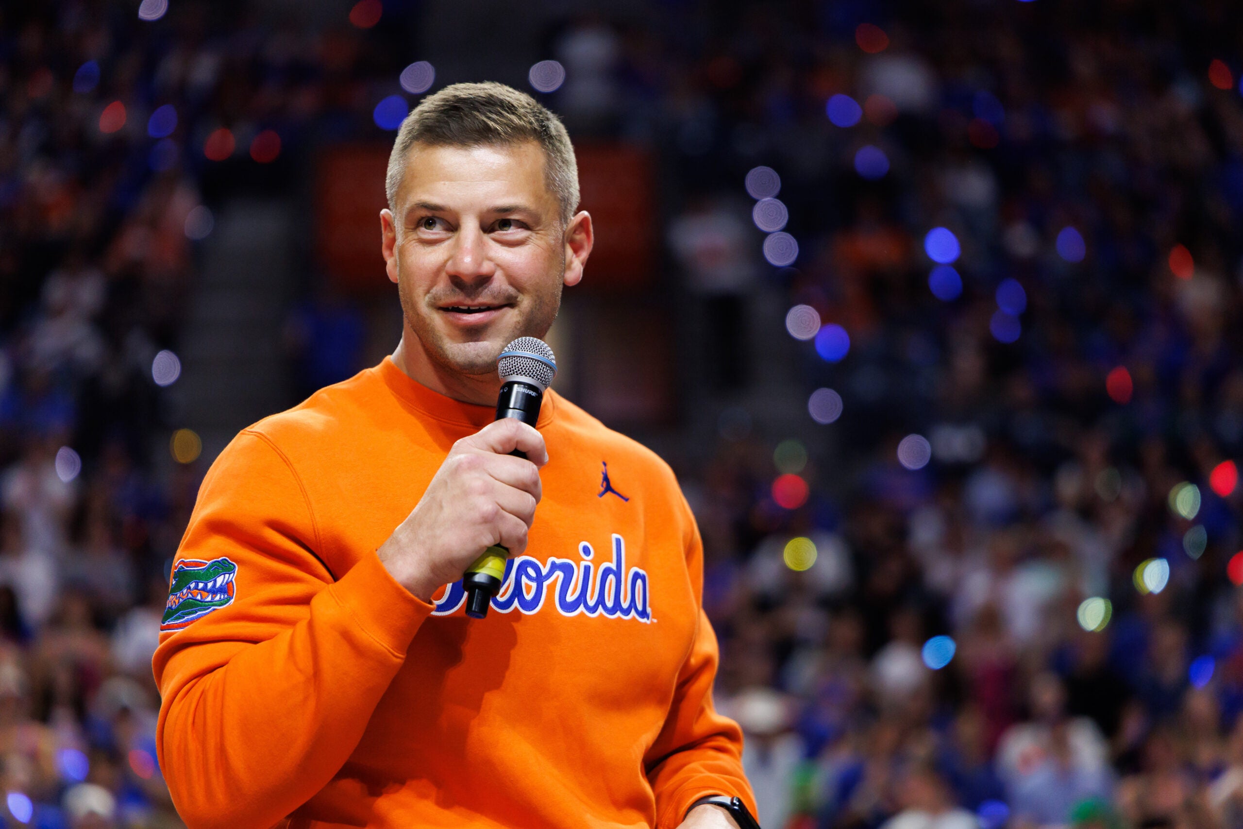 Jan 24, 2026; Gainesville, Florida, USA; Florida Gators Football head coach Jon Sumrall addresses the crowd during a timeout against the Auburn Tigers during the first half at Exactech Arena at the Stephen C. O'Connell Center.