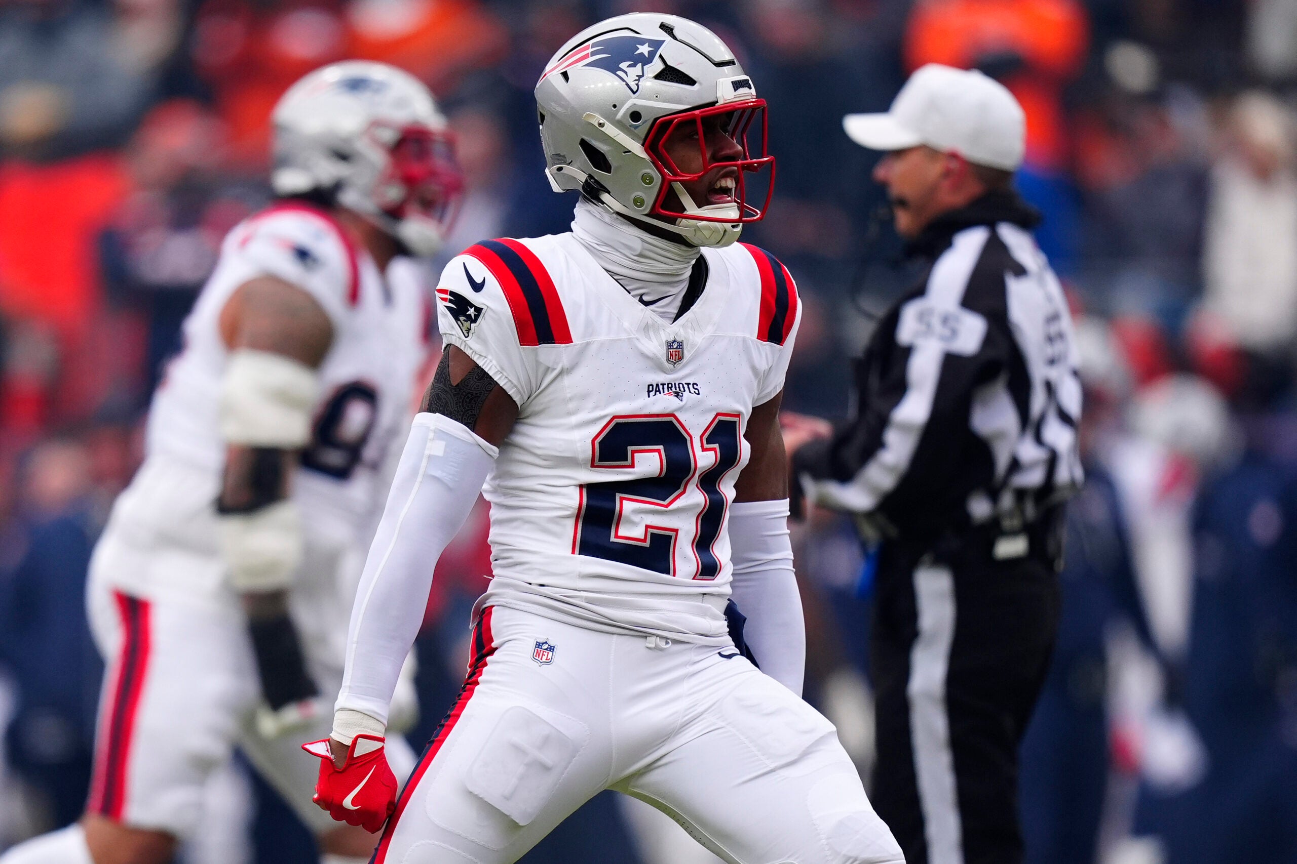 Jan 25, 2026; Denver, CO, USA; New England Patriots safety Jaylinn Hawkins (21) reacts against the Denver Broncos during the first half in the 2026 AFC Championship Game at Empower Field at Mile High.
