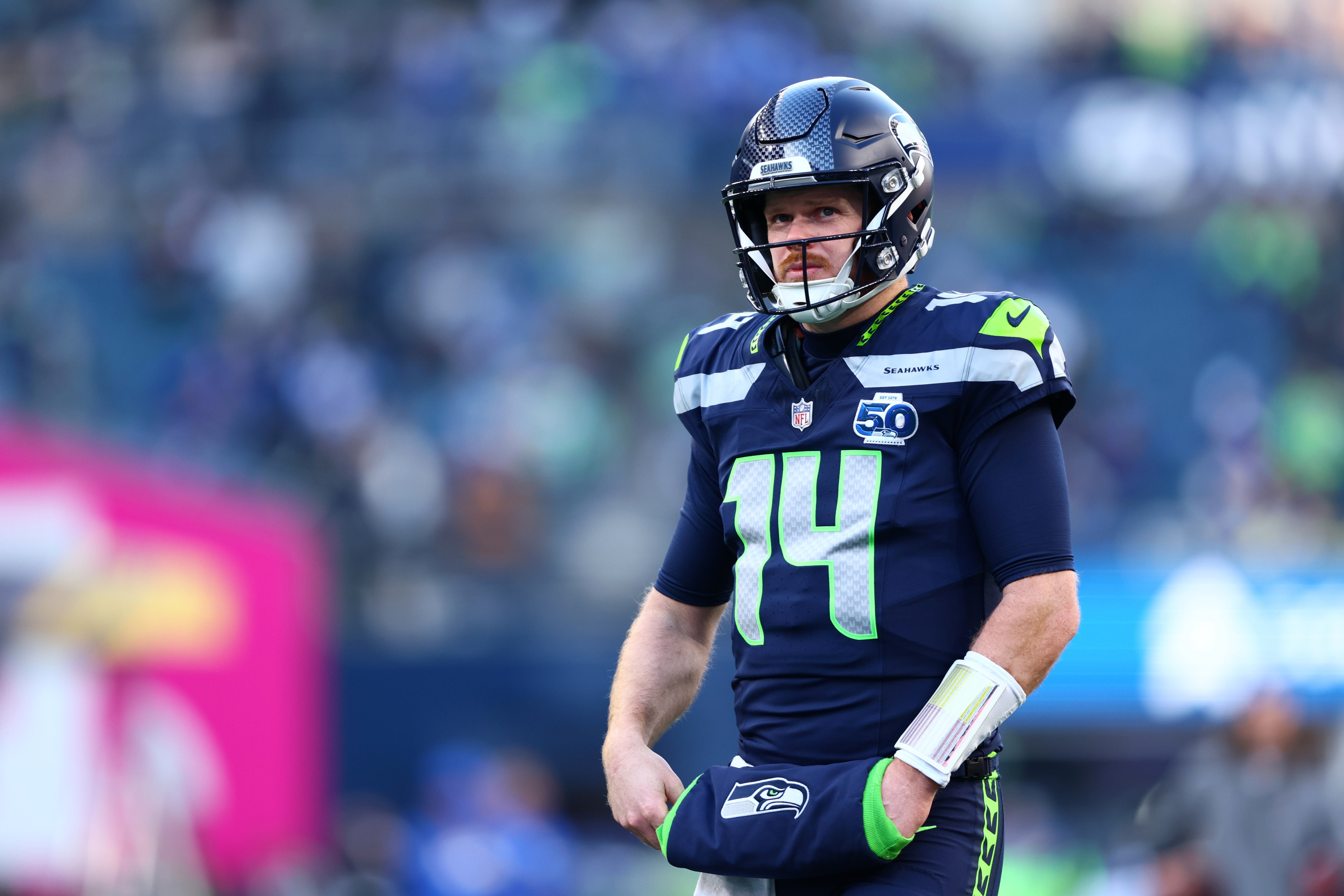 Jan 25, 2026; Seattle, WA, USA; Seattle Seahawks quarterback Sam Darnold (14) looks on before the 2026 NFC Championship Game against the Los Angeles Rams at Lumen Field.