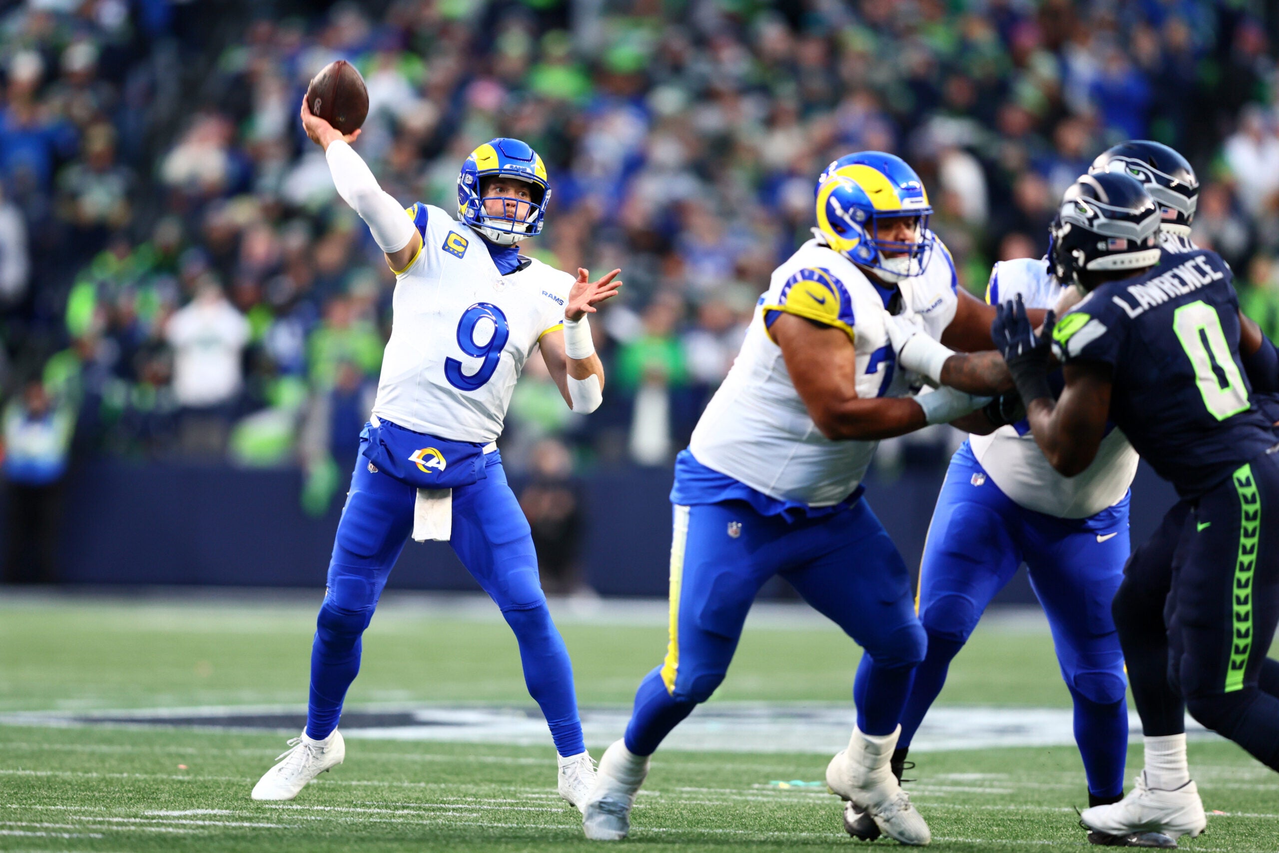 Jan 25, 2026; Seattle, WA, USA; Los Angeles Rams quarterback Matthew Stafford (9) passes against the Seattle Seahawks during the first half in the 2026 NFC Championship Game at Lumen Field.
