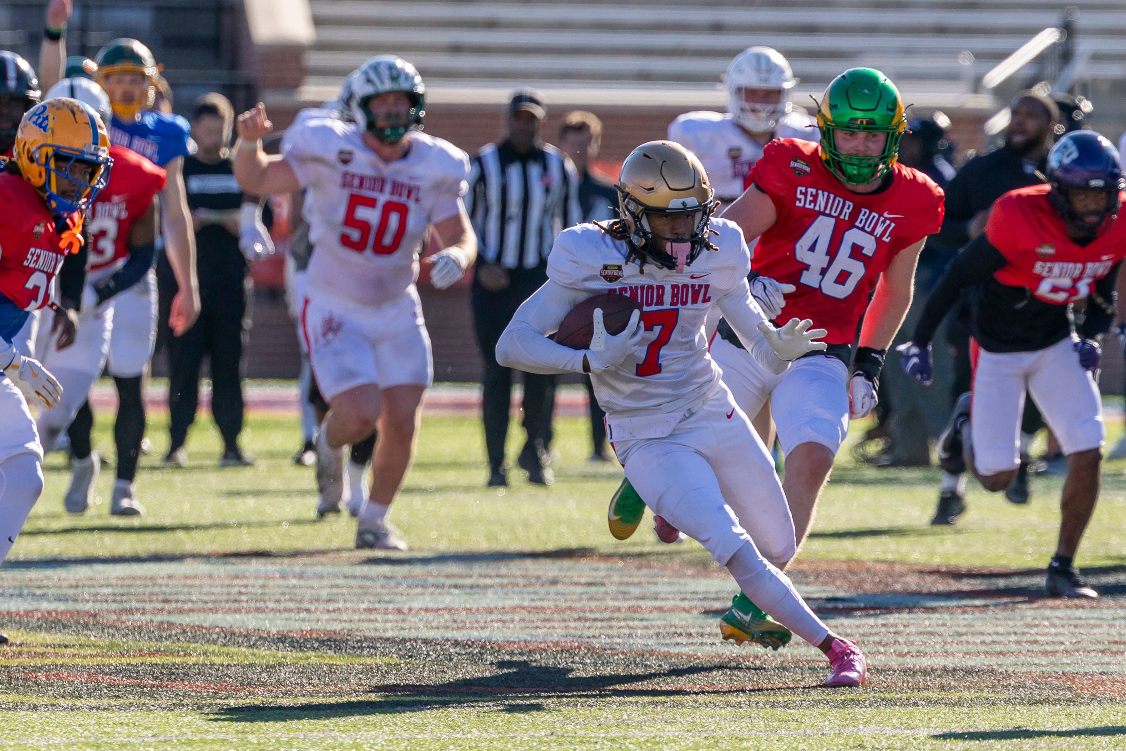 Jan 28, 2026; Mobile, AL, USA; National Team wide receiver Tyren Montgomery (7) of John Carroll runs after a catch during National Senior Bowl practice at Hancock Whitney Stadium. Mandatory Credit: Vasha Hunt-Imagn Images