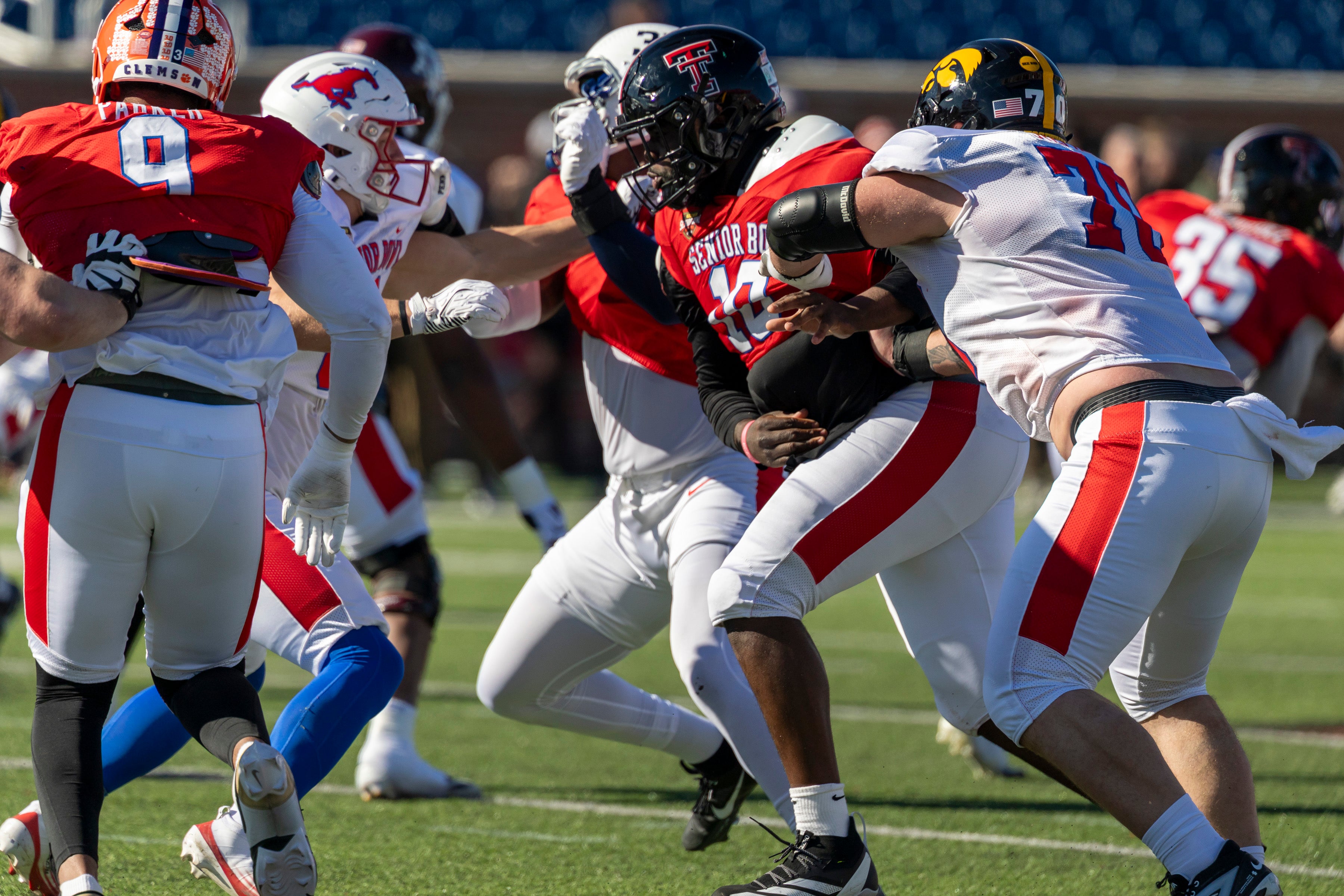 Jan 28, 2026; Mobile, AL, USA; National Team defensive tackle Lee Hunter (10) of Texas Tech works against National Team offensive lineman Beau Stephens (70) of Iowa during National Senior Bowl practice at Hancock Whitney Stadium.
