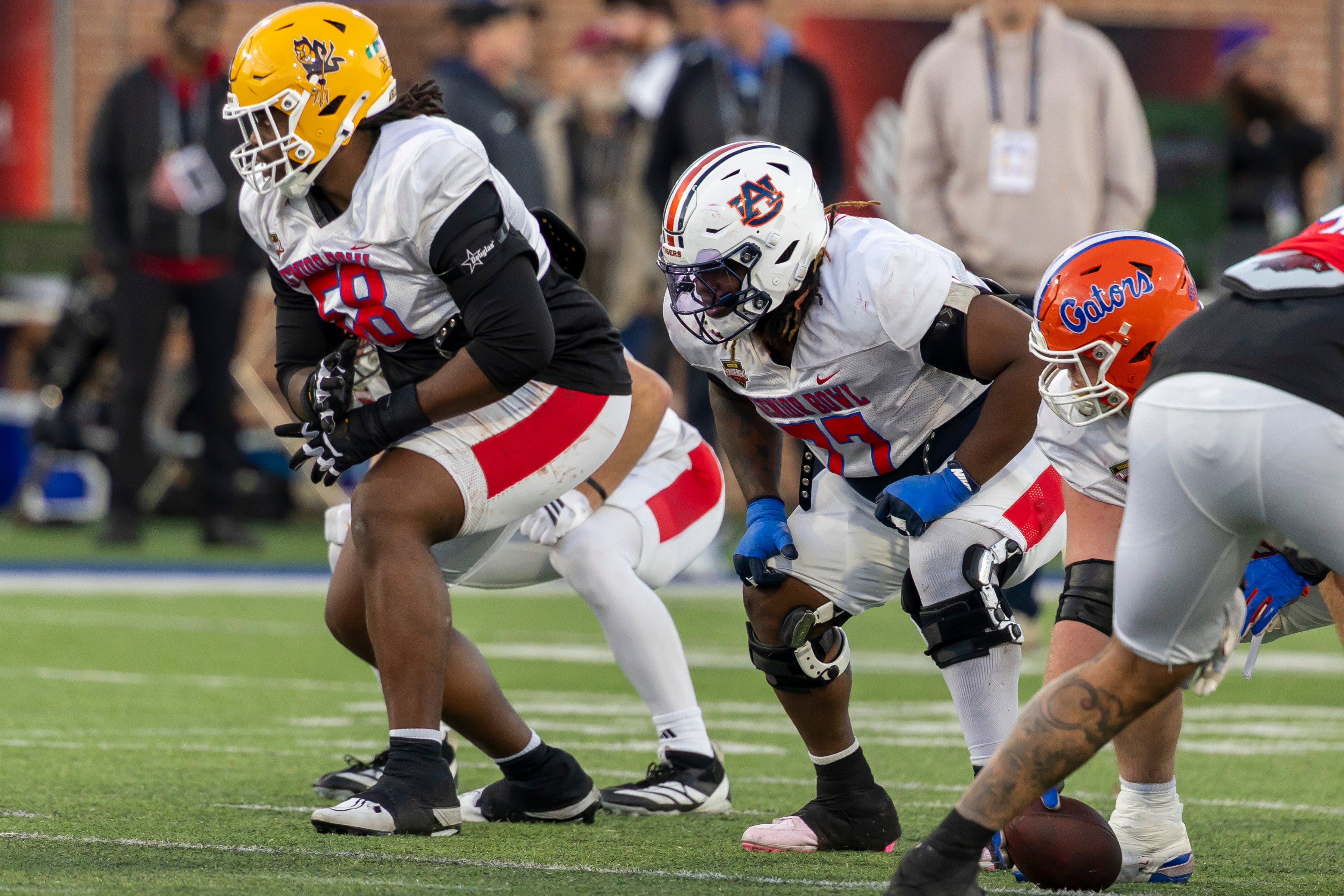 Jan 28, 2026; Mobile, AL, USA; American Team offensive lineman Max Iheanachor (58) of Arizona State and American Team offensive lineman Jeremiah Wright (77) of Auburn line up for a play during American Senior Bowl practice at Hancock Whitney Stadium.