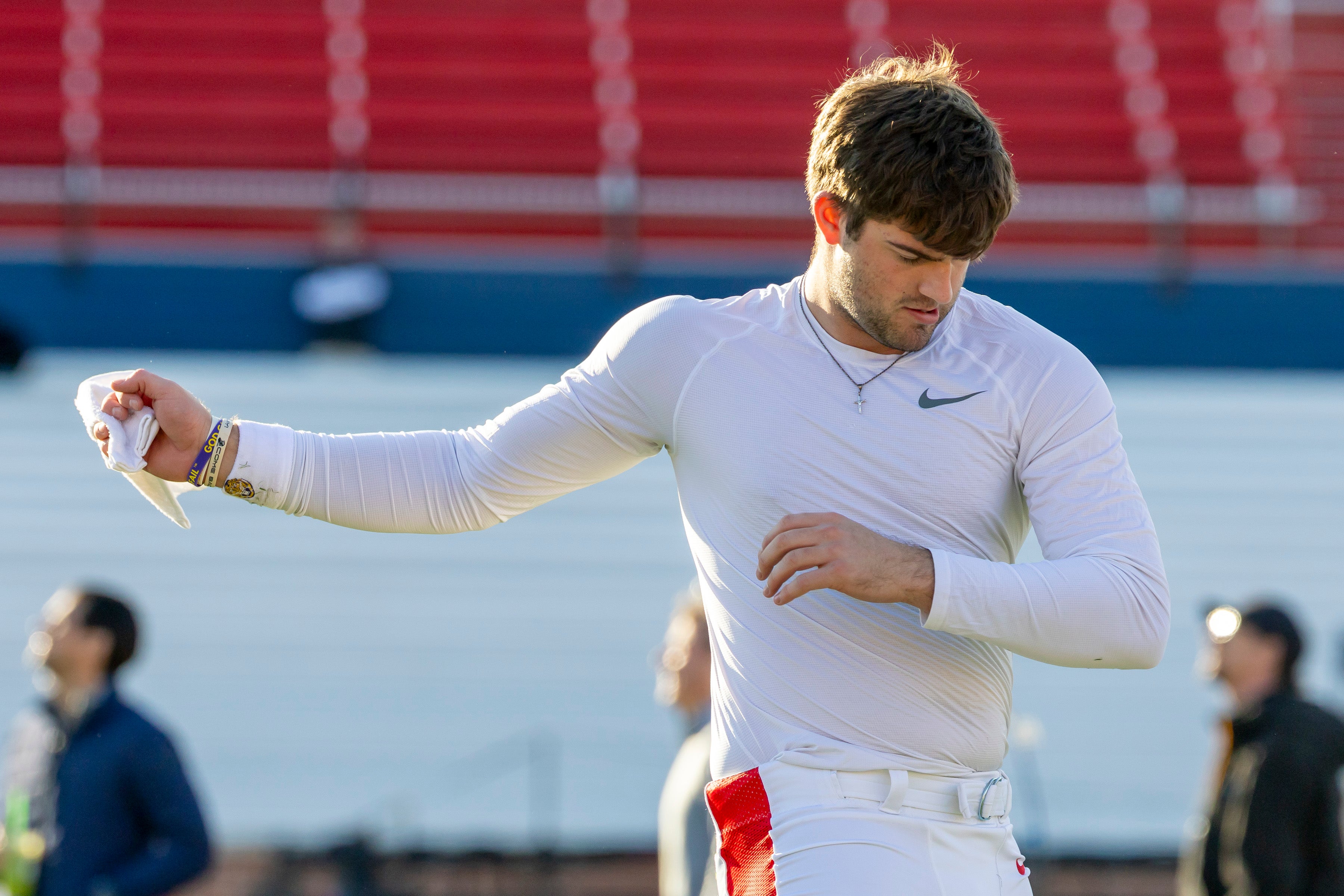 Jan 29, 2026; Mobile, AL, USA; American quarterback Garrett Nussmeier (13) of LSU warms up before American Senior Bowl practice at Hancock Whitney Stadium.