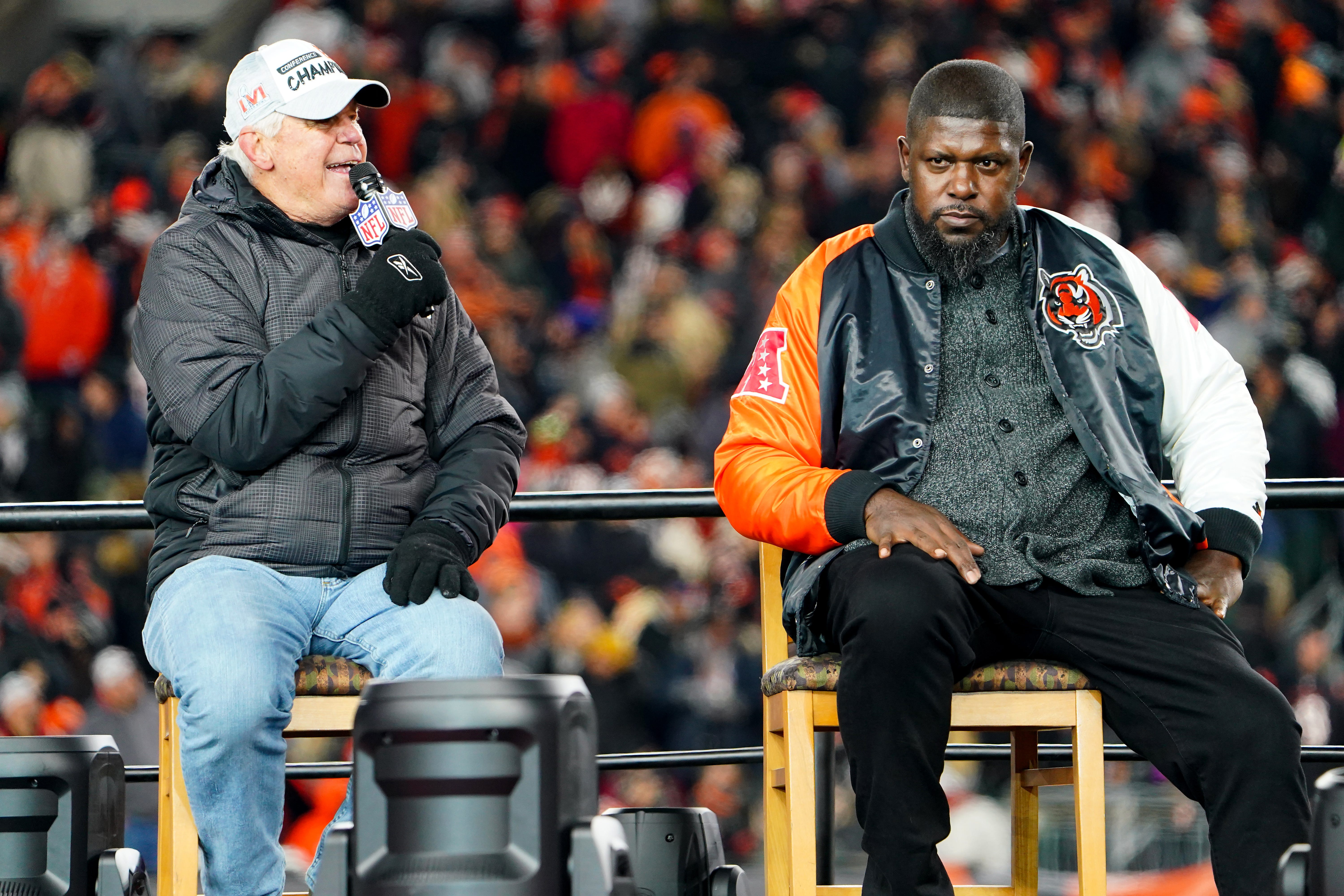 Former Cincinnati Bengals quarterback Ken Anderson, left, and offensive tackle Willie Anderson answer questions at a question and answer session during the Super Bowl LVI Opening Night Fan Rally on Feb. 7, 2022, at Paul Brown Stadium.