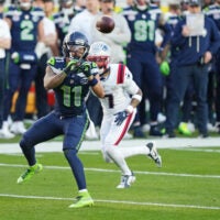 Feb 8, 2026; Santa Clara, CA, USA; Seattle Seahawks wide receiver Jaxon Smith-Njigba (11) makes a c atch against New England Patriots cornerback Carlton Davis III (7) during the first quarter in Super Bowl LX at Levi's Stadium.