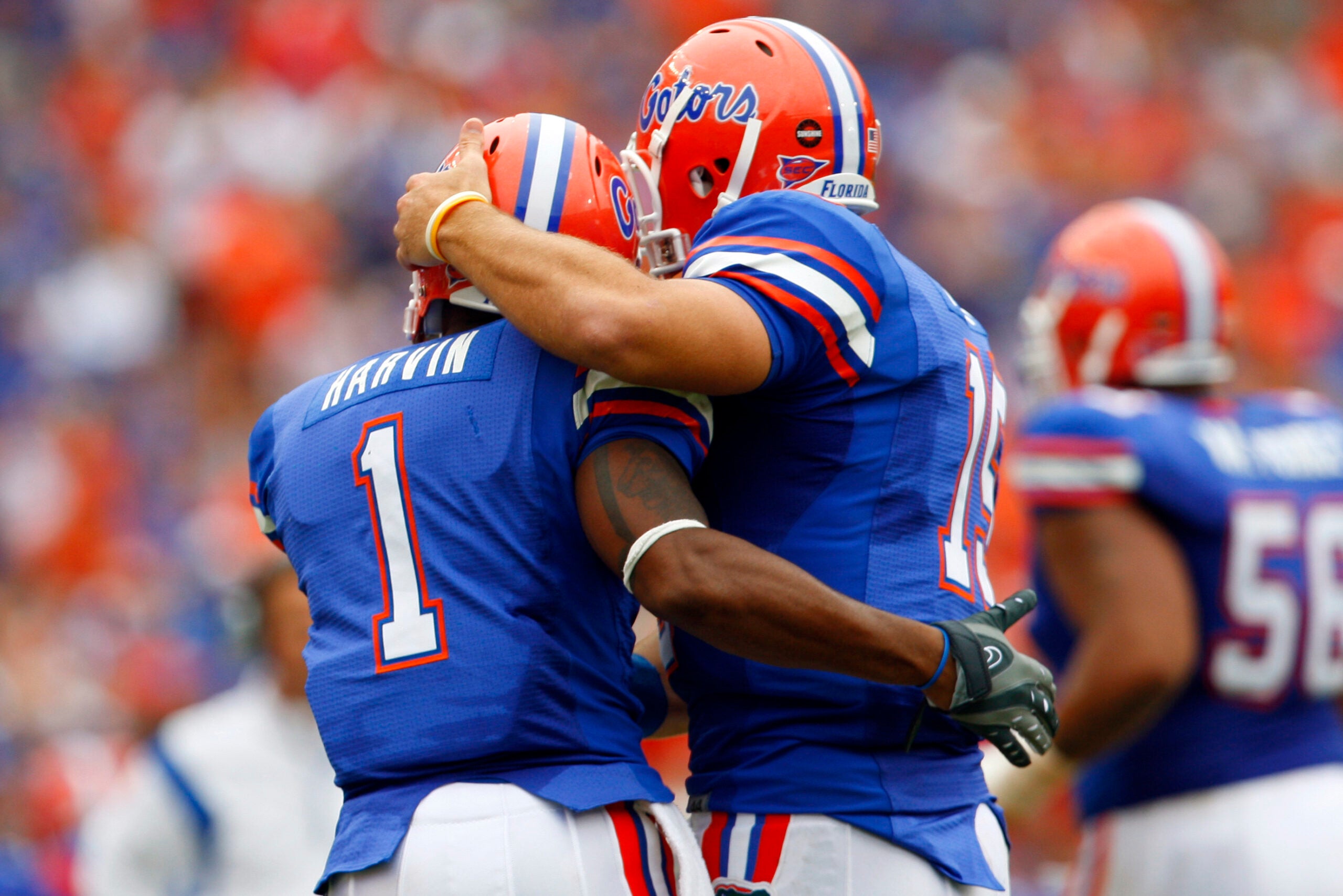 October 25, 2008; Gainesville FL, USA; Florida Gators quarterback Tim Tebow (15) hugs Florida Gators receiver Percy Harvin (1) after he scored a touchdown during the first half against the Kentucky Wildcats at Ben Hill Griffin Stadium.
