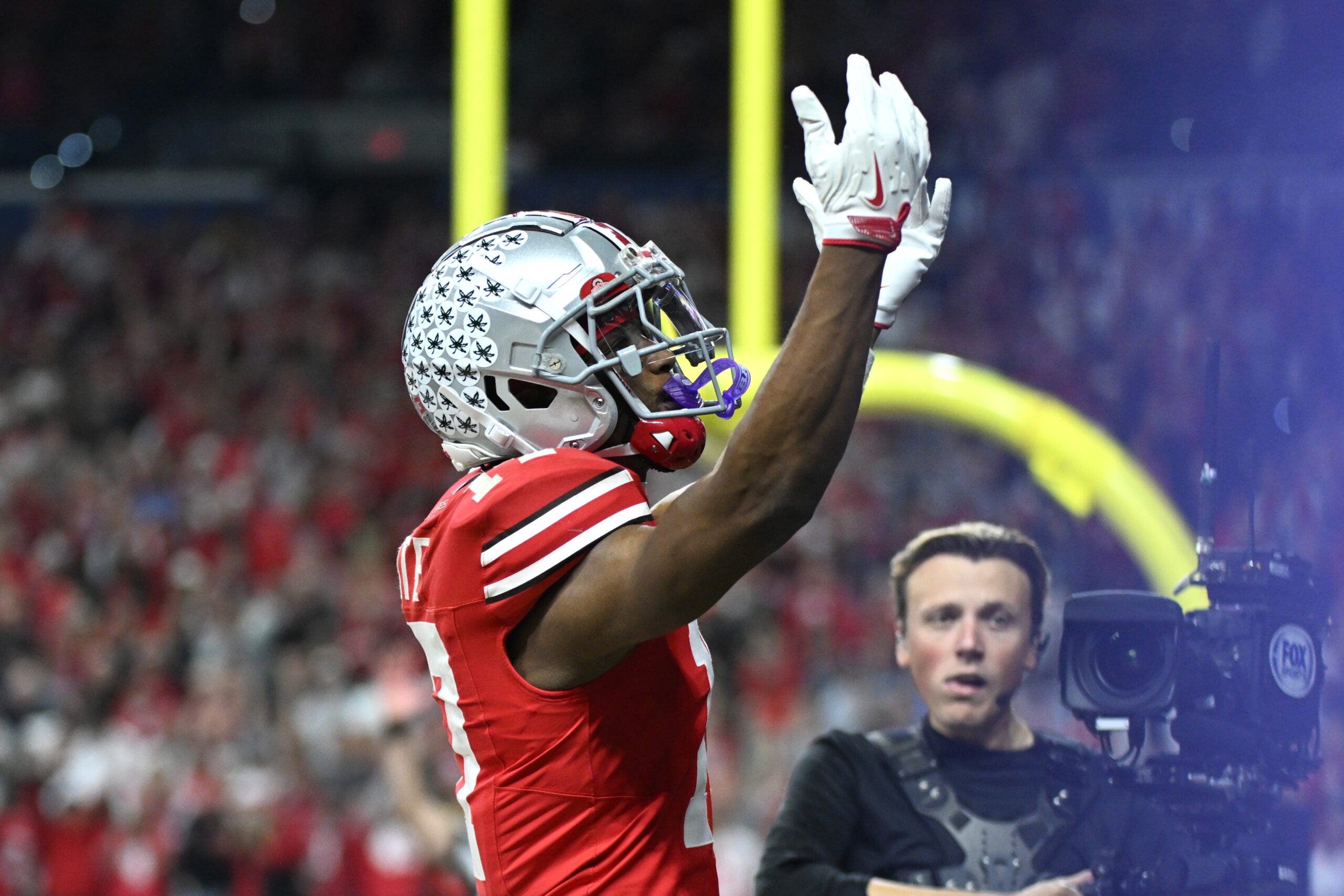 Dec 6, 2025; Indianapolis, IN, USA; Ohio State Buckeyes wide receiver Carnell Tate (17) celebrates after scoring a touchdown against the Indiana Hoosiers in the first quarter during the 2025 Big Ten championship game at Lucas Oil Stadium.