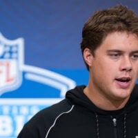 Feb 28, 2026; Indianapolis, IN, USA; Utah offensive lineman Caleb Lomu (OL33) speaks to members of the media during the NFL Combine at the Indiana Convention Center.