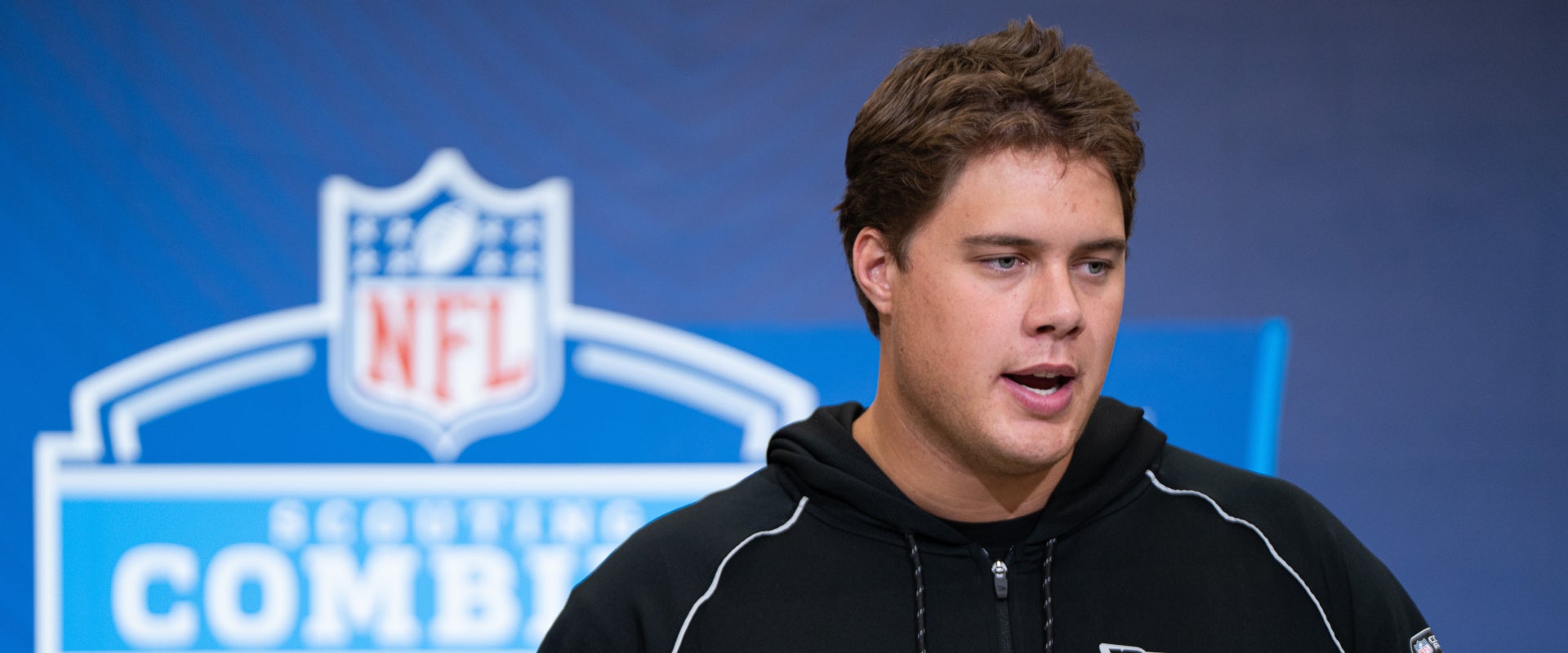 Feb 28, 2026; Indianapolis, IN, USA; Utah offensive lineman Caleb Lomu (OL33) speaks to members of the media during the NFL Combine at the Indiana Convention Center.
