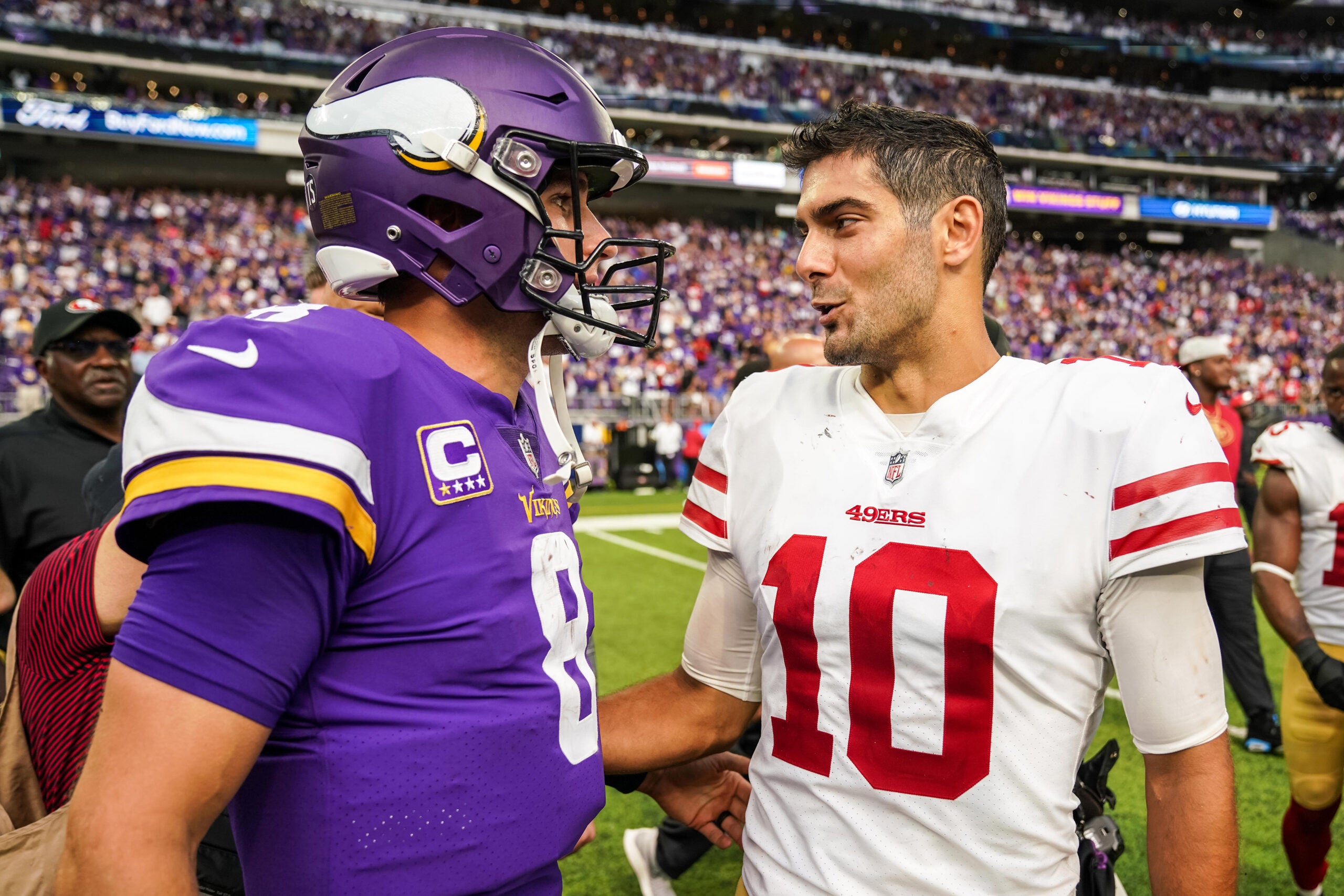 Sep 9, 2018; Minneapolis, MN, USA; Minnesota Vikings quarterback Kirk Cousins (8) talks with San Francisco 49ers quarterback Jimmy Garoppolo (10) following the game at U.S. Bank Stadium.