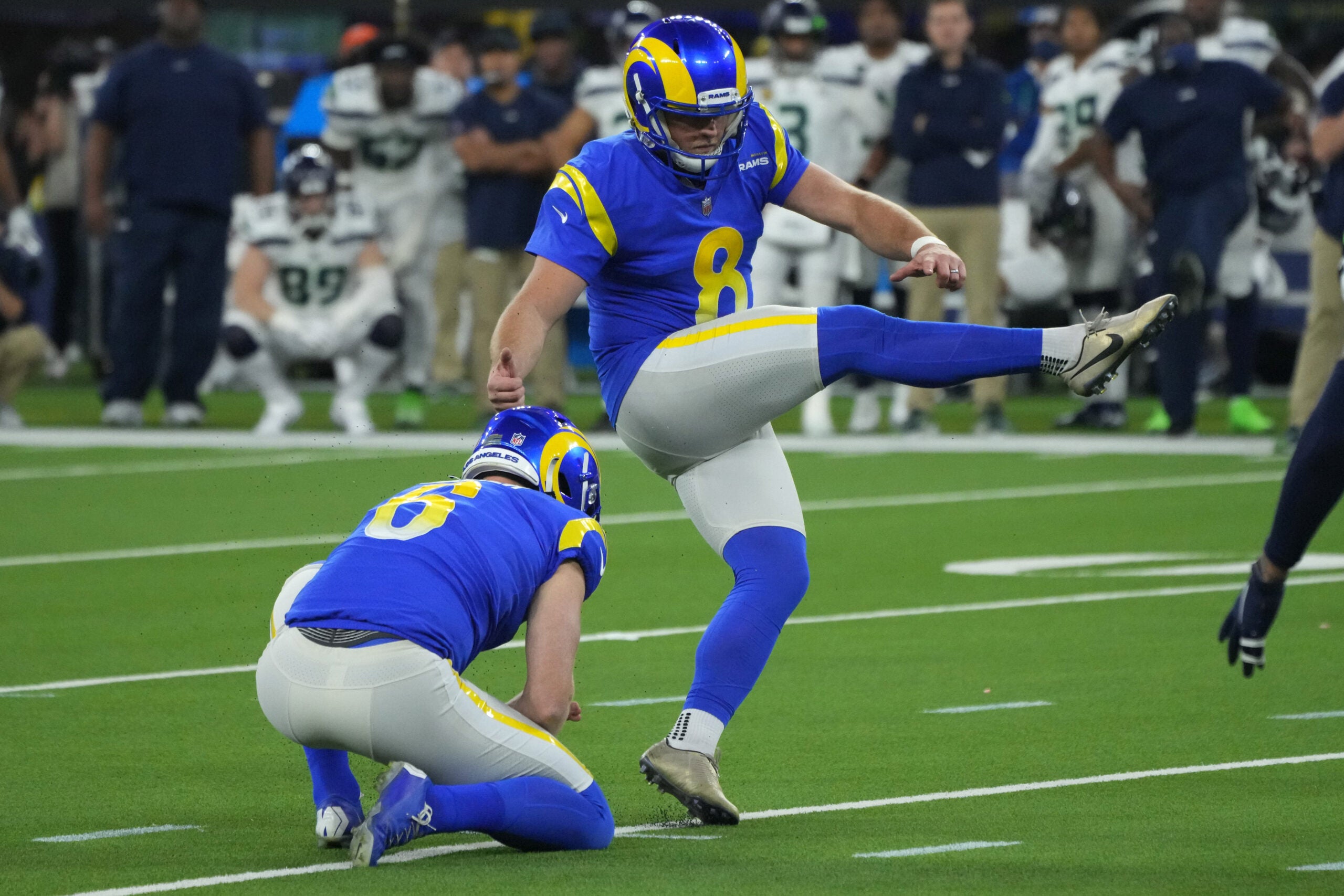 Dec 21, 2021; Inglewood, California, USA; Los Angeles Rams kicker Matt Gay (8) kicks a 35-yard field goal out of the hold of punter Johnny Hekker (6) in the second half against the Seattle Seahawks at SoFi Stadium. The Rams defeated the Seahawks 20-10.