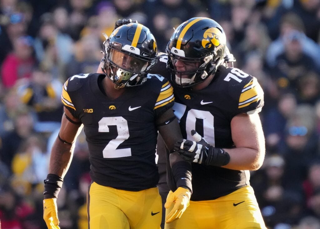Iowa offensive lineman Beau Stephens (70) celebrates with running back Kaleb Johnson in the second quarter against Nebraska during a NCAA football game on Friday, Nov. 25, 2022, at Kinnick Stadium in Iowa City.