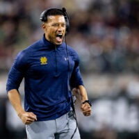 Dec 30, 2022; Jacksonville, FL, USA; Notre Dame Fighting Irish head coach Marcus Freeman reacts after a touchdown during the second half against the South Carolina Gamecocks in the 2022 Gator Bowl at TIAA Bank Field. Mandatory Credit: Matt Pendleton-USA TODAY Sports