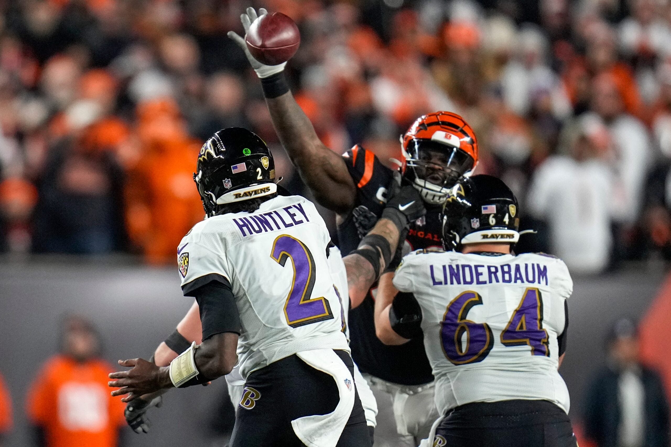 Cincinnati Bengals defensive tackle DJ Reader (98) deflects a pass by Baltimore Ravens quarterback Tyler Huntley (2) in the fourth quarter during an NFL wild-card playoff football game between the Baltimore Ravens and the Cincinnati Bengals, Sunday, Jan. 15, 2023, at Paycor Stadium in Cincinnati. The Bengals advanced to the Divisional round of the playoffs with a 24-17 win over the Ravens.