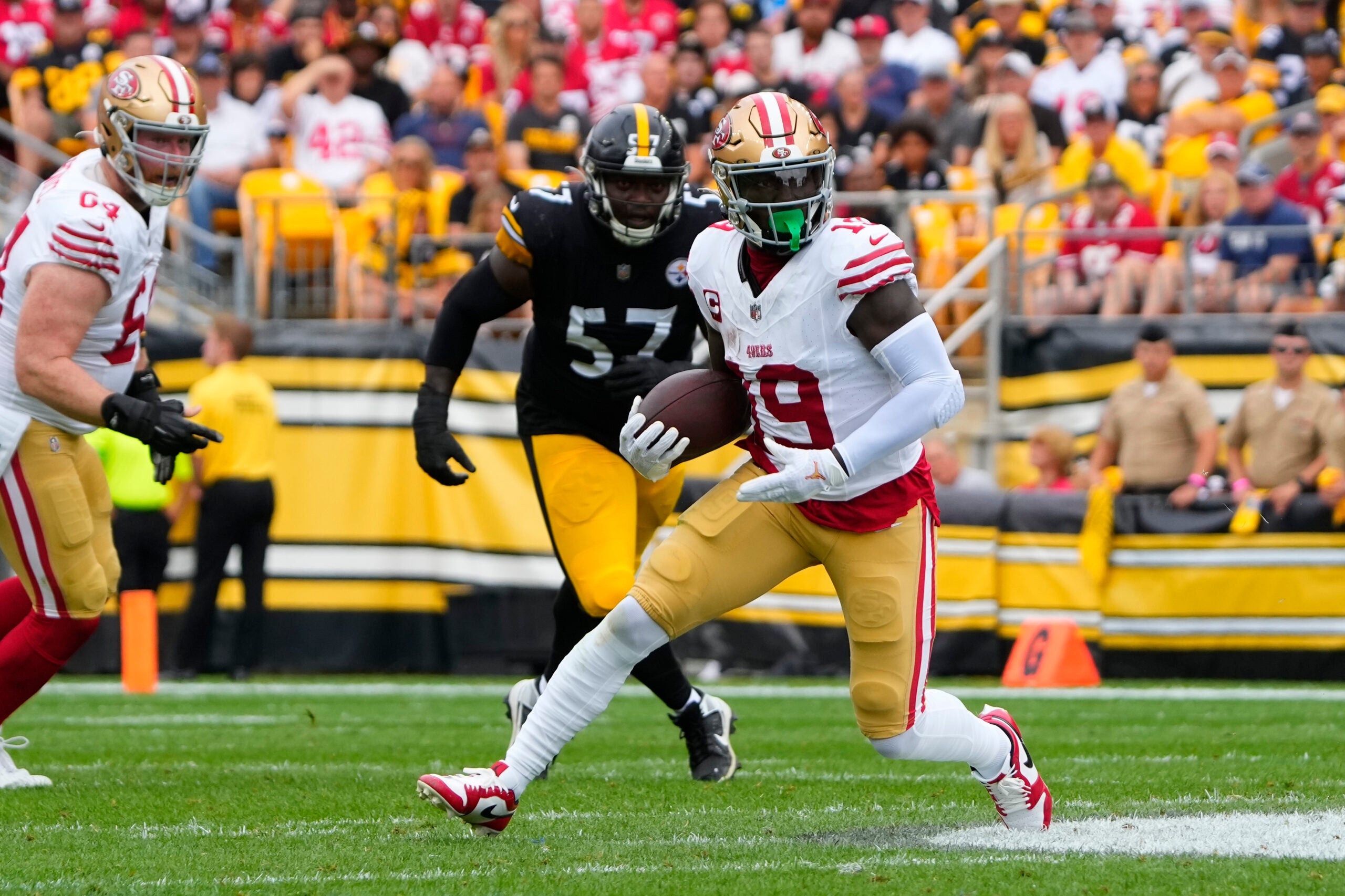 Sep 10, 2023; Pittsburgh, Pennsylvania, USA; San Francisco 49ers wide receiver Deebo Samuel (19) runs with the ball after making a catch against the Pittsburgh Steelers during the first half at Acrisure Stadium