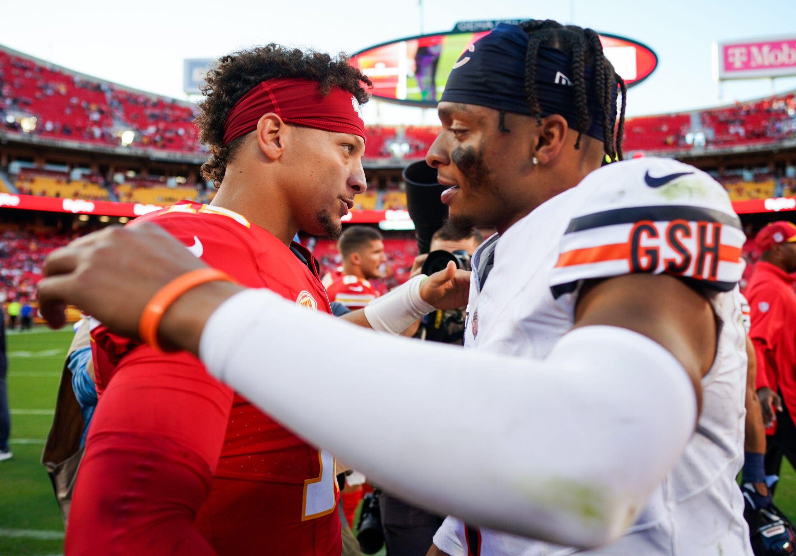 Sep 24, 2023; Kansas City, Missouri, USA; Kansas City Chiefs quarterback Patrick Mahomes (15) greets Chicago Bears quarterback Justin Fields (1) after a game at GEHA Field at Arrowhead Stadium.