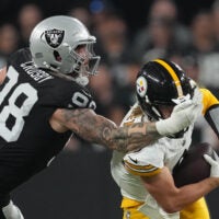 Sep 24, 2023; Paradise, Nevada, USA; Las Vegas Raiders defensive end Maxx Crosby (98) tackles Pittsburgh Steelers quarterback Kenny Pickett (8) in the first half at Allegiant Stadium.