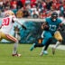 Nov 12, 2023; Jacksonville, Florida, USA; Jacksonville Jaguars wide receiver Christian Kirk (13) runs with the ball past San Francisco 49ers cornerback Ambry Thomas (20) during the second quarter at EverBank Stadium.