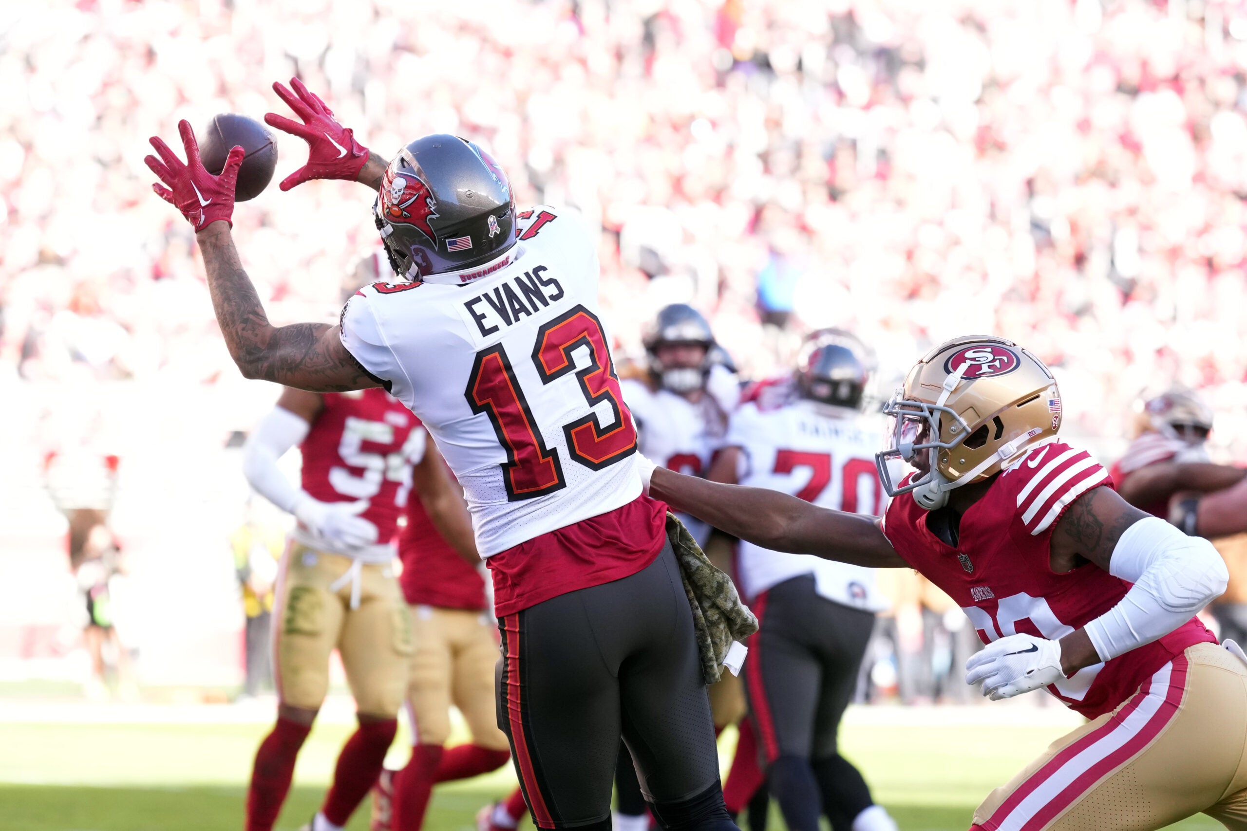 Nov 19, 2023; Santa Clara, California, USA; Tampa Bay Buccaneers wide receiver Mike Evans (13) catches a touchdown pass against San Francisco 49ers cornerback Ambry Thomas (right) during the second quarter at Levi's Stadium.